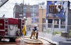 St. Paul firefighters battled a fire at a construction site across from Xcel Energy Center in downtown St. Paul on Aug. 4.