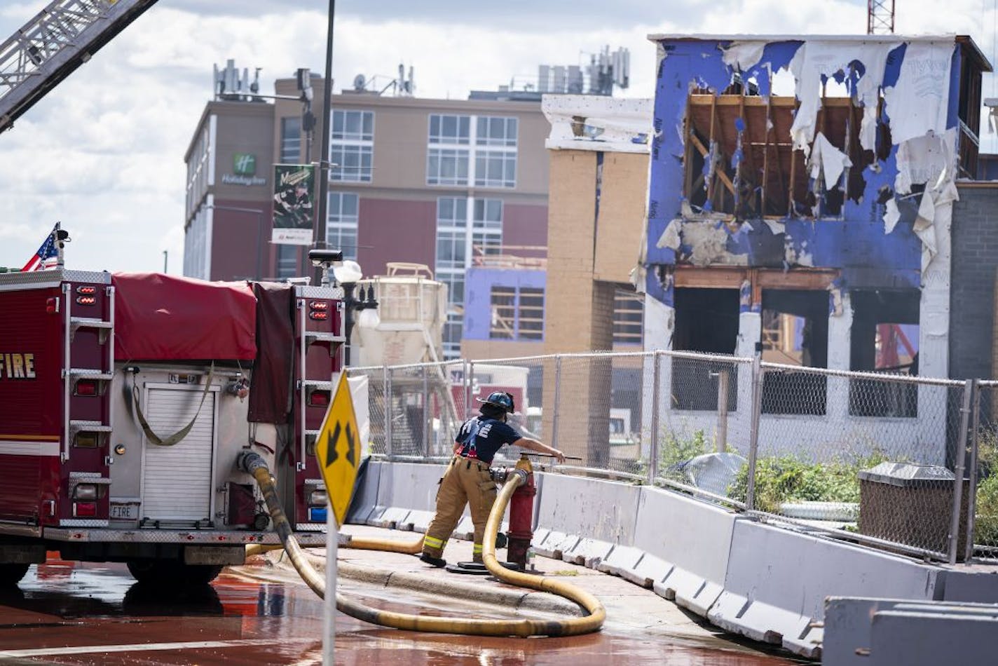 St. Paul firefighters battled a fire at a construction site across from Xcel Energy Center in downtown St. Paul on Aug. 4.