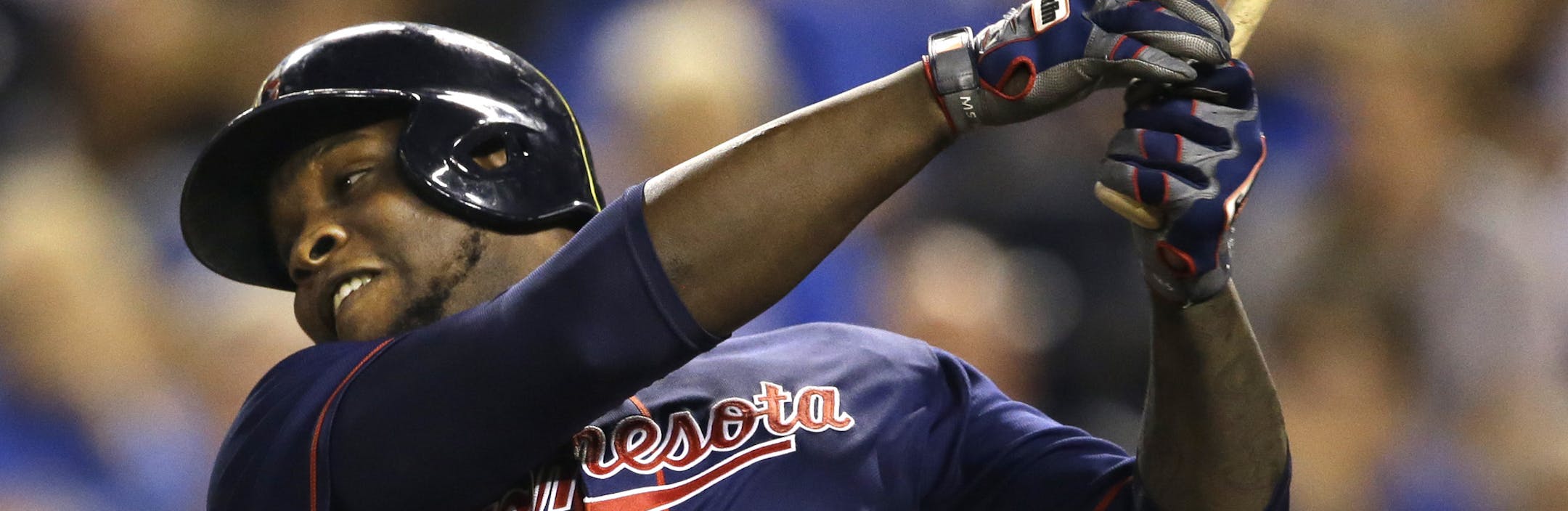 Minnesota Twins designated hitter Miguel Sano watches a solo home run off Kansas City Royals relief pitcher Franklin Morales during the 12th inning of a baseball game at Kauffman Stadium in Kansas City, Mo., Wednesday, Sept. 9, 2015. The Twins defeated the Royals 3-2 in 12 innings. (AP Photo/Orlin Wagner) ORG XMIT: MOOW119
