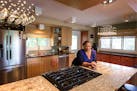 Jevetta Steele poses for a portrait inside her renovated kitchen in Golden Valley. The kitchen makeover was filmed for the DIY Network show "I Hate My