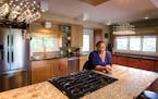 Jevetta Steele poses for a portrait inside her renovated kitchen in Golden Valley. The kitchen makeover was filmed for the DIY Network show "I Hate My
