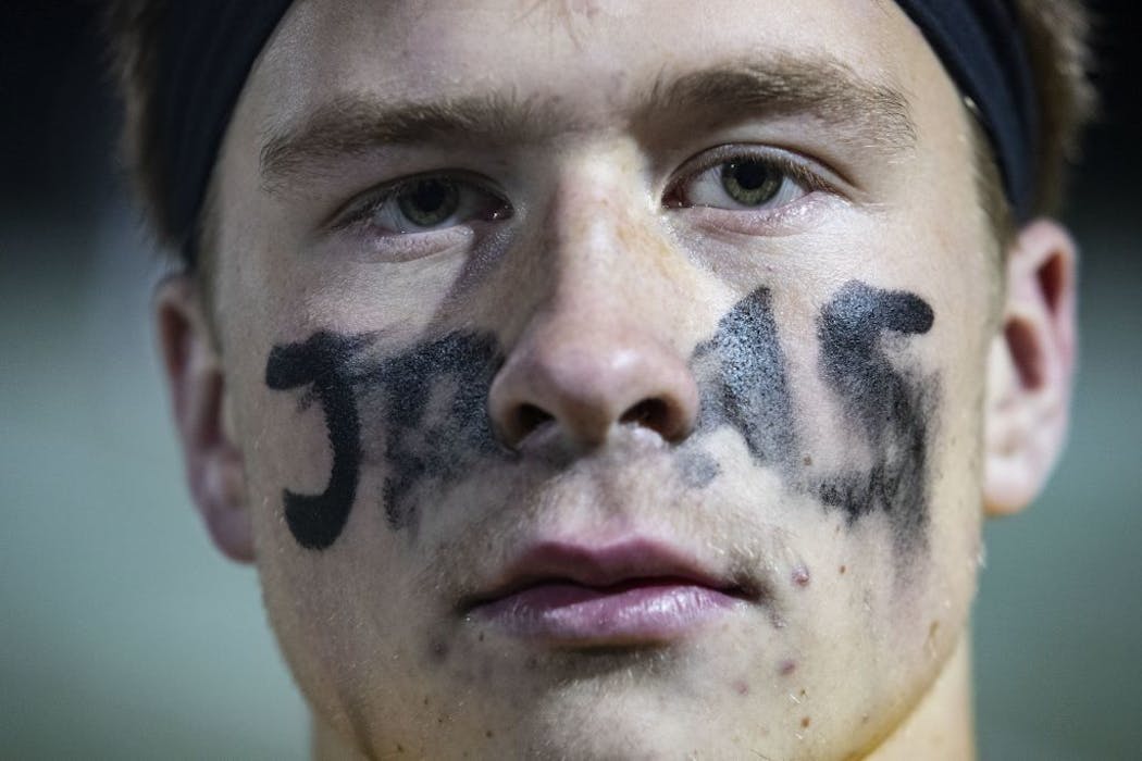 Esko football player Brock House (2) painted his face in honor of Jackson Pfister.