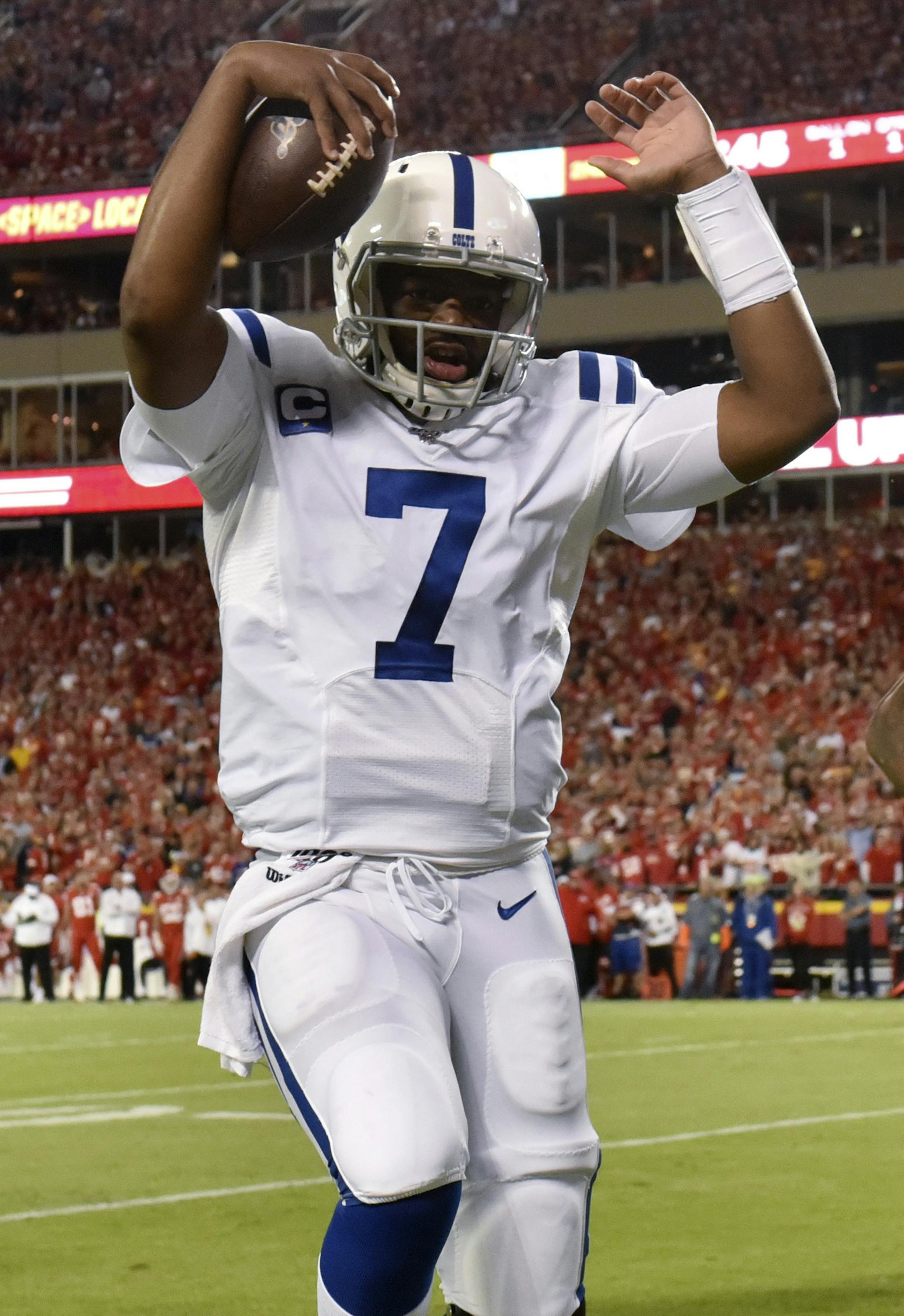 Indianapolis Colts quarterback Jacoby Brissett (7) scores a touchdown next to Kansas City Chiefs linebacker Damien Wilson (54) during the first half of an NFL football game in Kansas City, Mo., Sunday, Oct. 6, 2019. (AP Photo/Ed Zurga)