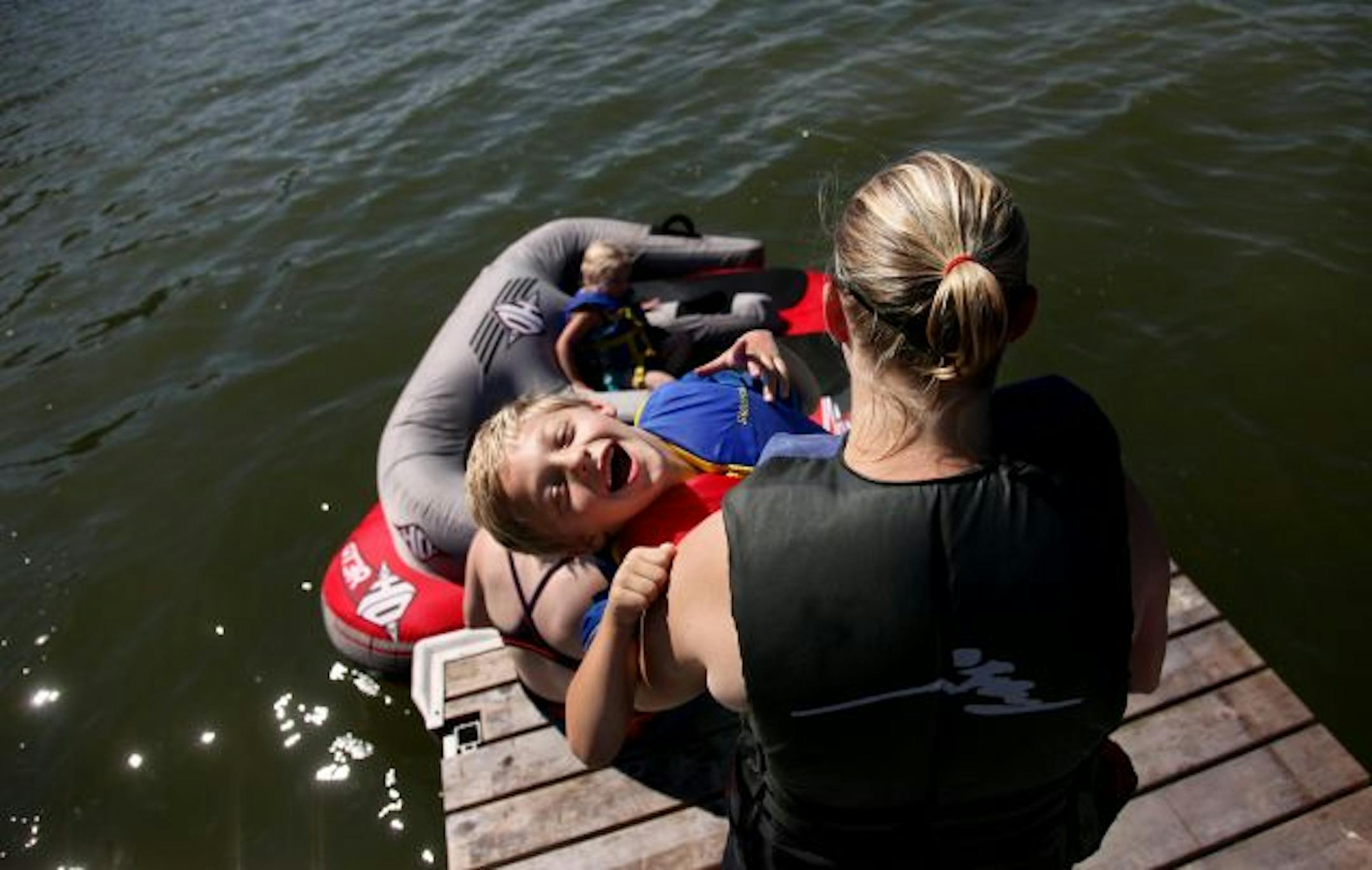 Fun for all: Nicole Stover and son Logan, 6, who has cerebral palsy, got ready for a tube ride.
