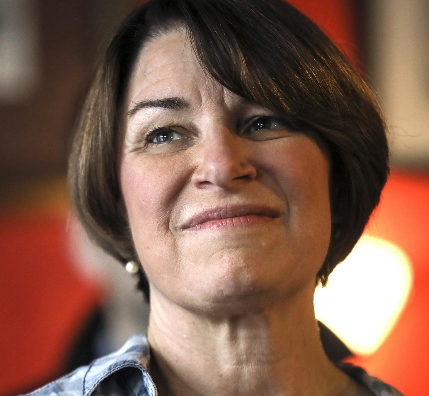 Sen. Amy Klobuchar, D-Minn., listens as she is introduced during a campaign stop at The Village Trestle in Goffstown, N.H., Monday, Feb. 18, 2019. (AP Photo/Cheryl Senter)