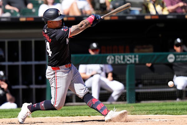 The Twins' Jose Miranda notches an RBI single during the seventh inning against the White Sox in Chicago on Wednesday.
