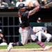 The Twins' Jose Miranda notches an RBI single during the seventh inning against the White Sox in Chicago on Wednesday.