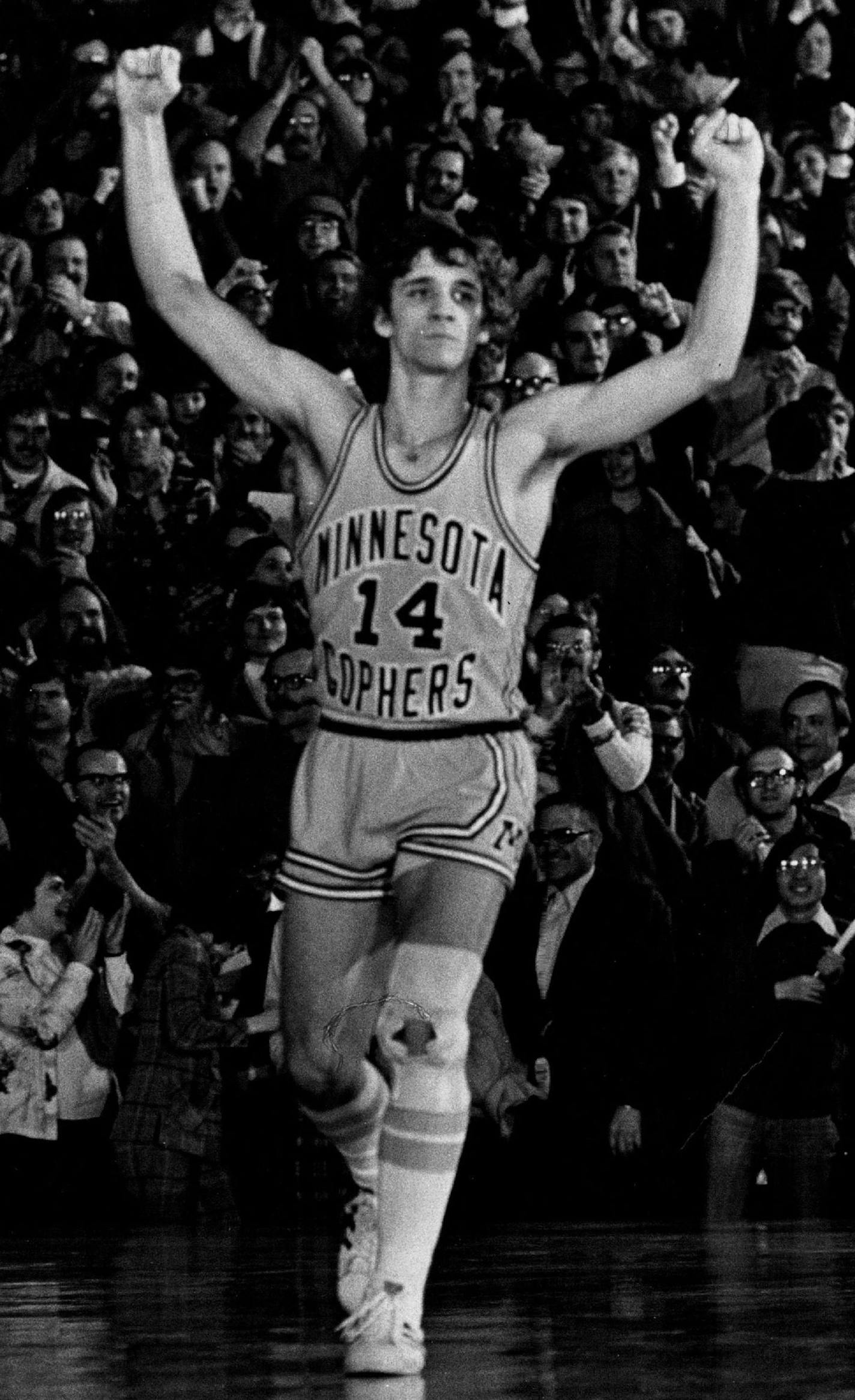 December 19, 1975, Gophers guard Phil Saunders raised his arms in victory as his team pulled ahead of the Marquette Warriors in the final overtime minute.