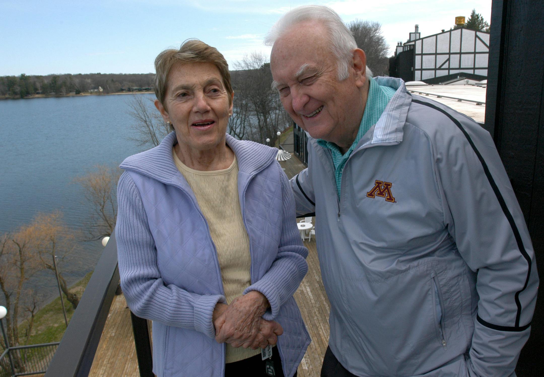Dutch and Irma Cragun trade memories of running their resort, Cragun's on Gull Lake, as they look over the lake from the balcony off of Dutch's office. They have been married for 49 years. Behind them on the far shore are the lakeshore cabins that make up part of the resort complex.