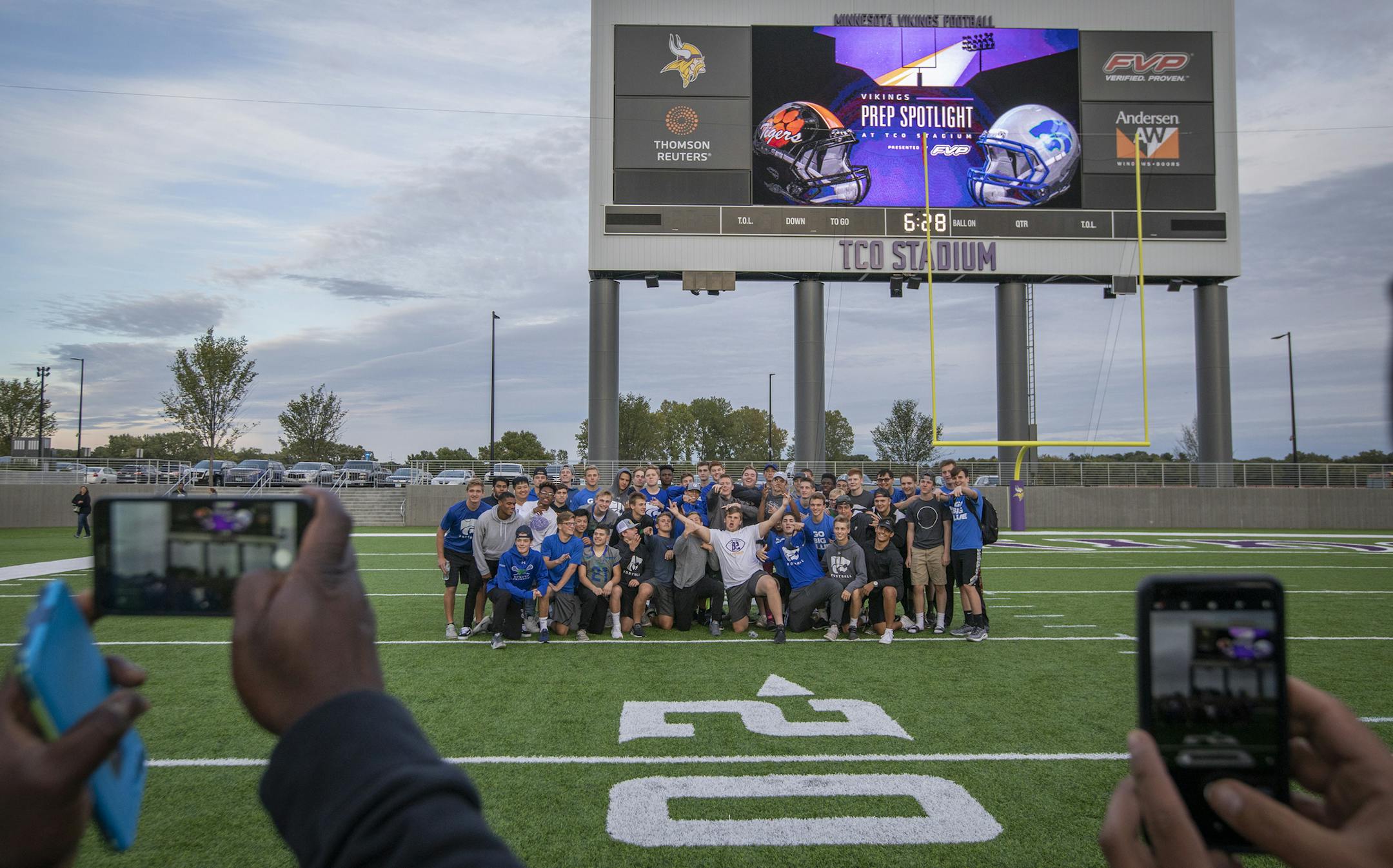 Eagan High School football players take a team photo on the field of TCO Stadium. ] LEILA NAVIDI ï leila.navidi@startribune.com BACKGROUND INFORMATION: Eagan High School football players have a team meal and walk through of TCO Stadium at the Vikings practice facility in Eagan on Thursday, September 27, 2018, the night before their football game against Farmington that will be the first prep football game to take place at the stadium.