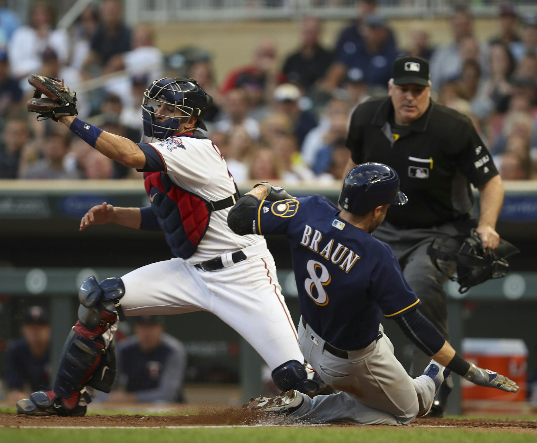 Milwaukee Brewers left fielder Ryan Braun was safe at home on a 2 RBI single by teammate Travis Shaw in the third inning. The throw from center field to Minnesota Twins catcher Jason Castro (21) was just a little too late. ] JEFF WHEELER &#xef; jeff.wheeler@startribune.com The Minnesota Twins began a four game inter-league series with the Milwaukee Brewers Monday night, August 7, 2017 at Target Field in Minneapolis.