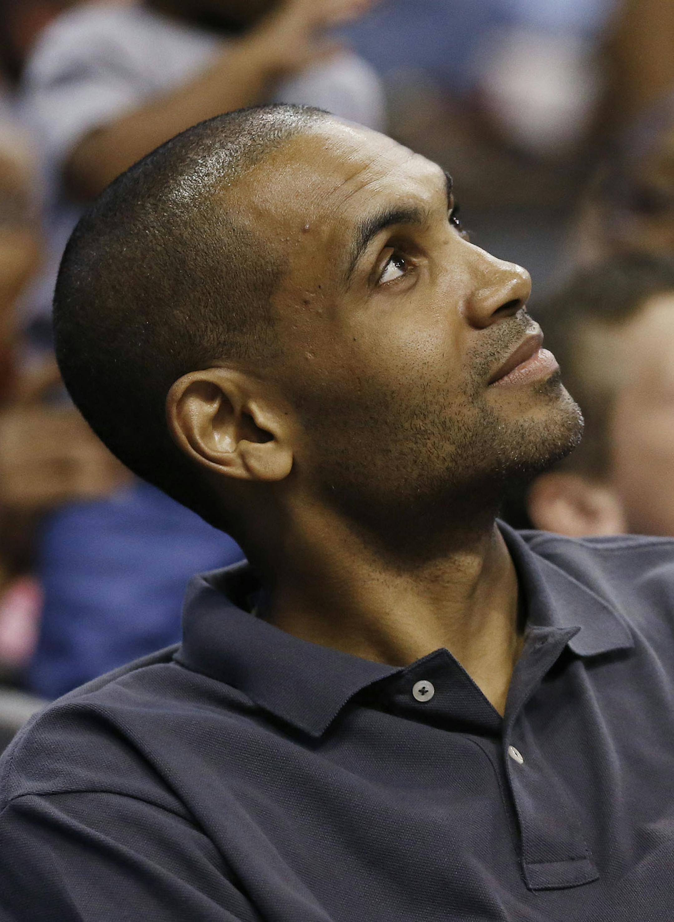 Retired NBA veteran Grant Hill, watches the Phoenix Mercury versus Los Angeles Sparks WNBA basketball game during the first half on Friday, June 14, 2013, in Phoenix. (AP Photo/Ross D. Franklin) ORG XMIT: NYOTK