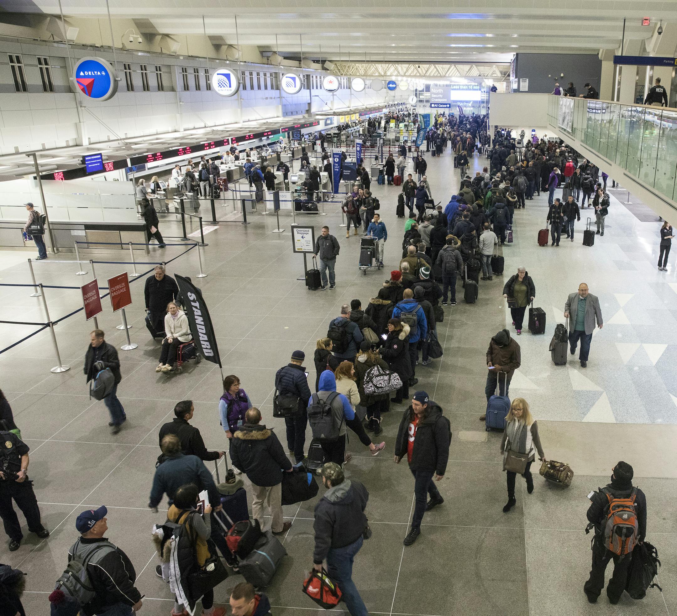 The security line stretches halfway through Terminal 1 early in the morning. ] LEILA NAVIDI ï leila.navidi@startribune.com BACKGROUND INFORMATION: The scene at MSP Airport Terminal 1 on the morning after the Super Bowl on Monday, February 5, 2018.