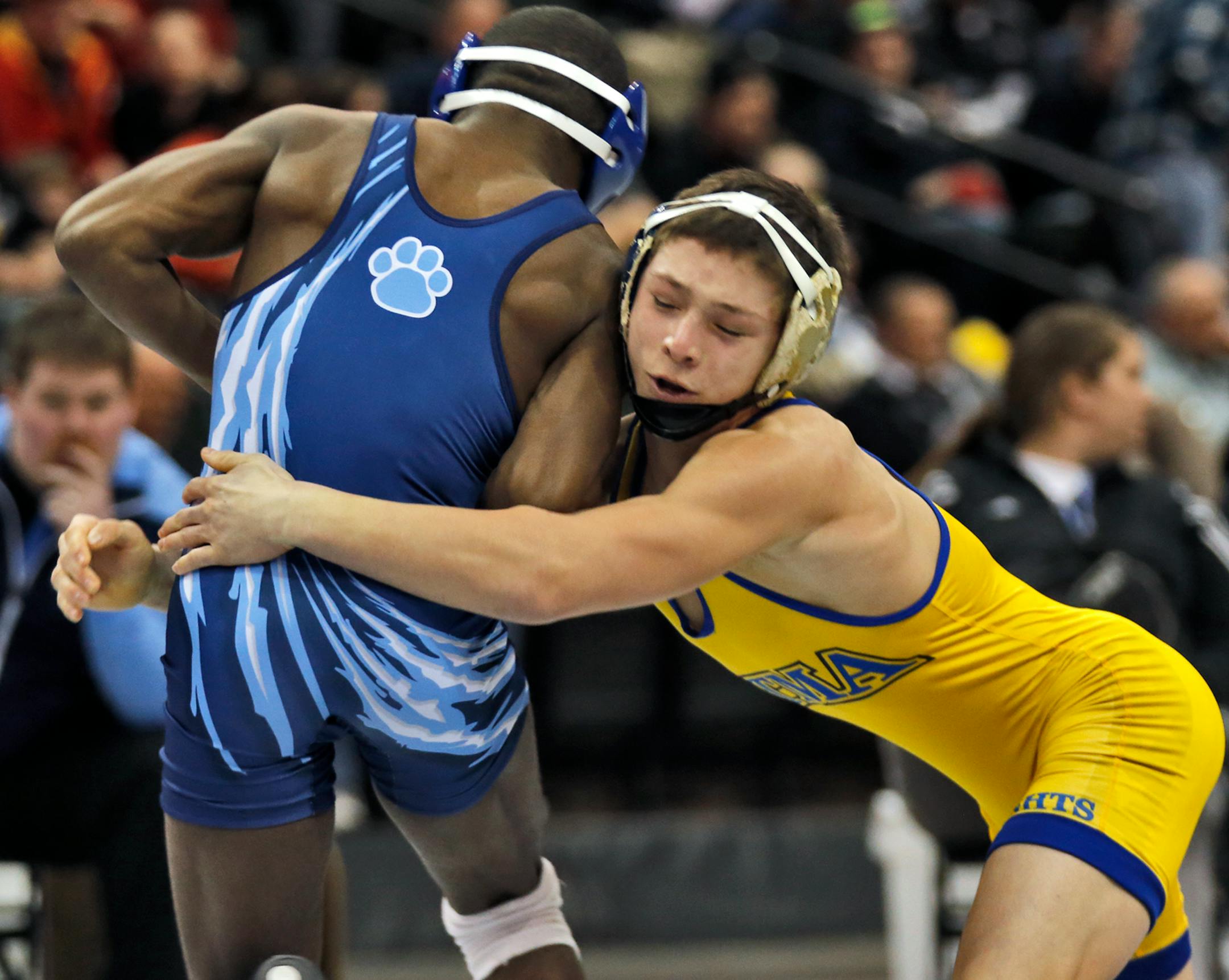 St. Michael-Albertville's Mitchell McKee, right, wrestled Blaine's Malik Stewart in the 3A 120 lb championship match. McKee won the match. [ Prep State Wrestling Individual Championships (MARLIN LEVISON/STARTRIBUNE(mlevison@startribune.com)