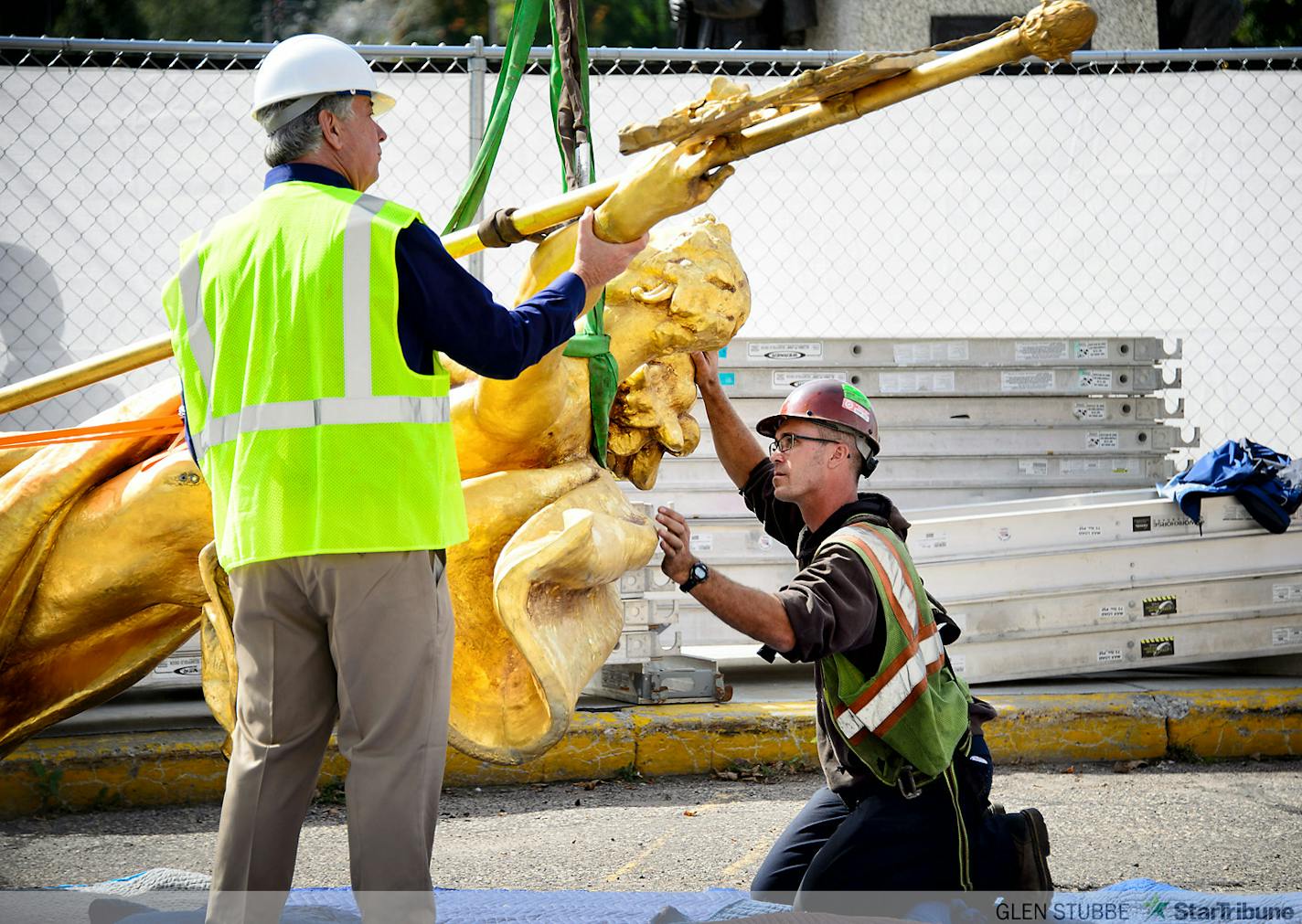 The charioteer figure who guides the golden horses on the Minnesota State Capitol Building's Quadriga statue were temporarily removed on Tuesday, September 23 to repair corrosion discovered at the statue's base. The repair is expected to take approximately three months when charioteer will return to the Quadriga.    ]   Tuesday, September  23, 2014   GLEN STUBBE * gstubbe@startribune.com