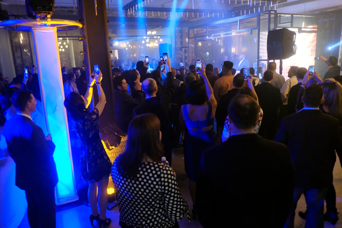 Guests watch a performance by Biz Markie at the NFL Media Super Bowl party at Chapman & Kirby, Friday, Feb. 3, 2017.