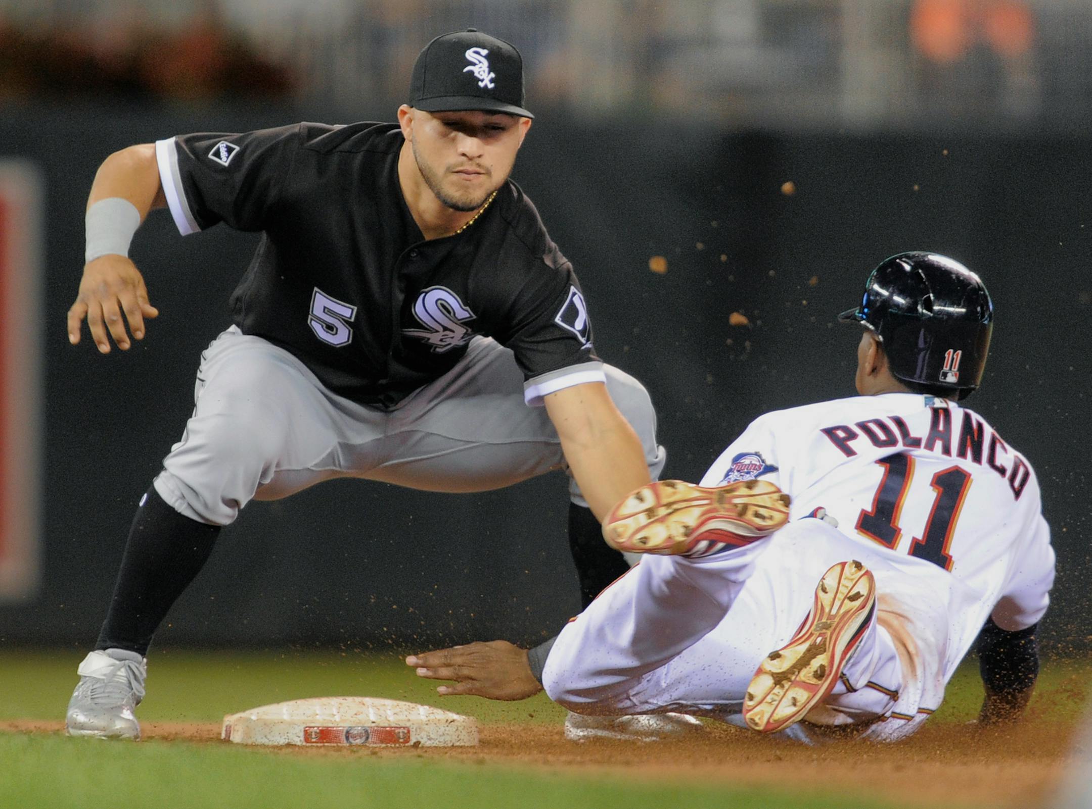 Chicago White Sox second baseman Carlos Sanchez (5) tags out the Minnesota Twins' Jorge Polanco (11) attempting to steal during the eighth inning of a baseball game, Thursday, Sept. 1, 2016, in Minneapolis. The Minnesota Twins broke their 13-game losing streak, beating the White Sox 8-5.(AP Photo/Tom Olmscheid)