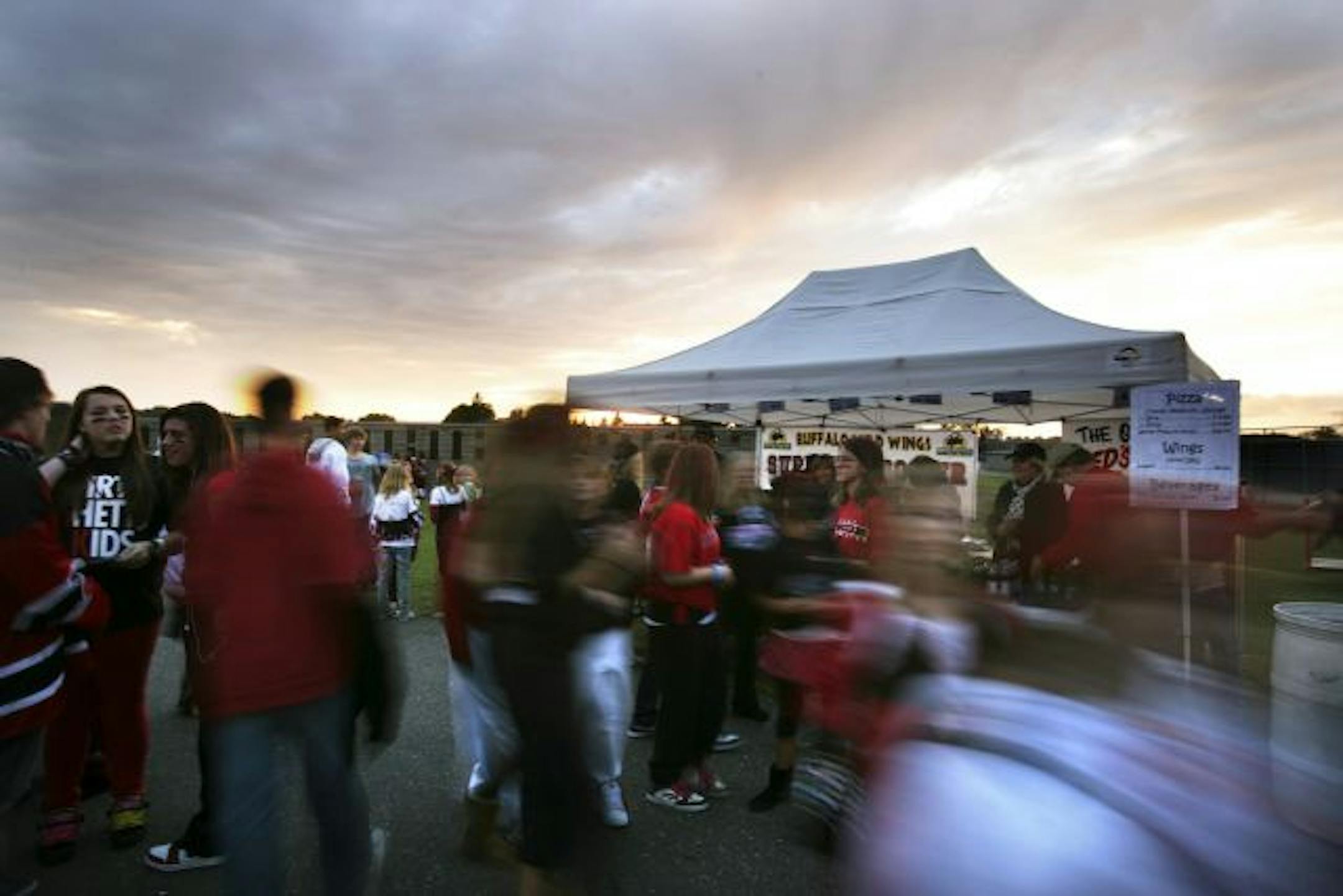 At the Stillwater football game on September 17, 2010 sales at all three concession stands the soccer booster club volunteered were brisk. At this stand, a slice of Red's Savoy Pizza cost $3 per slice and $5 for two slices, Honey BBQ wings cost $4 and beverages cost $2 per bottle.