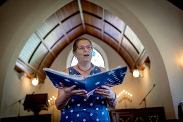 Michelle Wessely sings in the Cass Gilbert chapel during the Memorial Day festivities at Roselawn Cemetery on Monday. Every year on Memorial Day and J