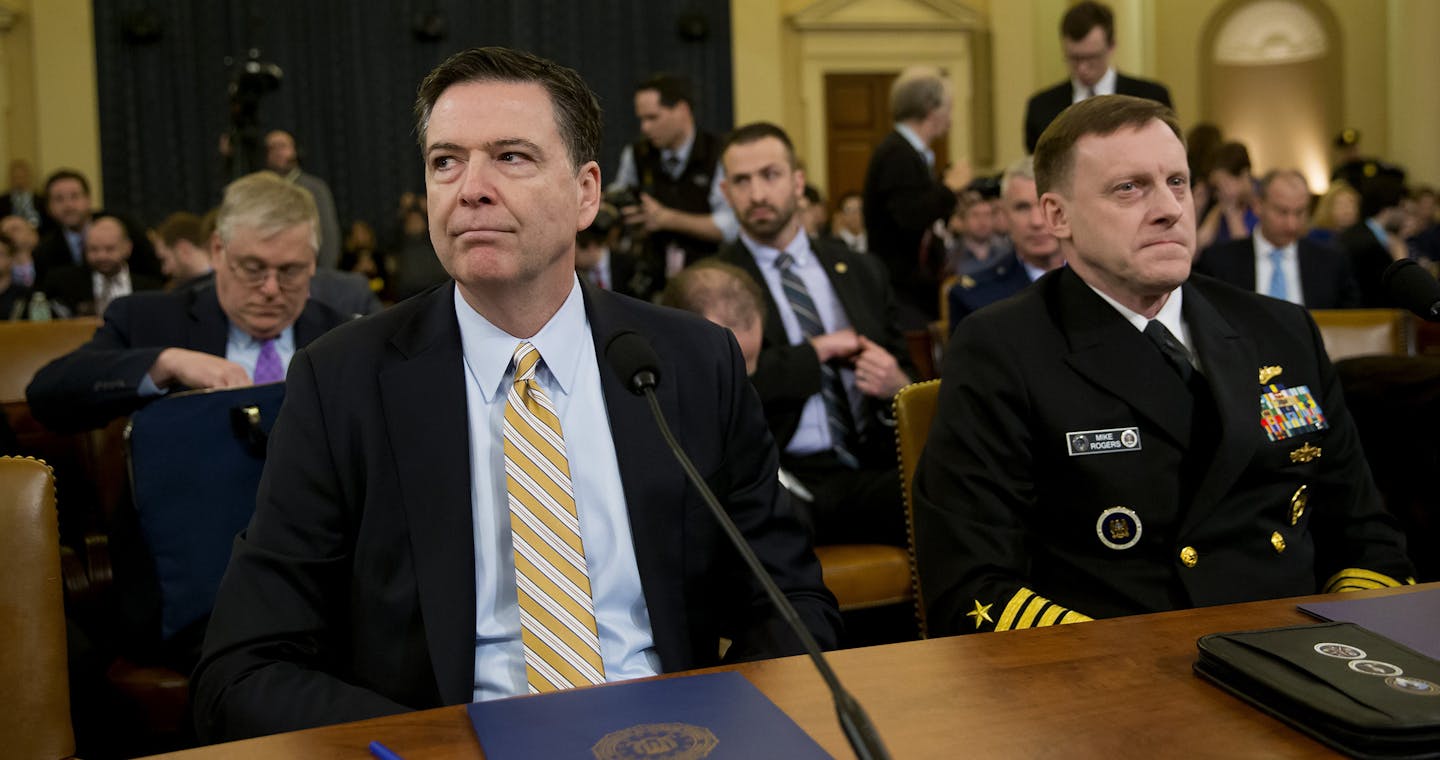 FBI Director James Comey and National Security Agency Director Adm. Michael Rogers testify before the House Permanent Select Committee on Intelligence on Capitol Hill, in Washington, March 20, 2017. Comey publicly confirmed an investigation into Russian interference in the presidential election and whether associates of the president were in contact with Moscow at the hearing on Monday. (Eric Thayer/The New York Times) ORG XMIT: MIN2017032014151127