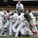 Mounds View players, topped by Charlie Callahan (28) celebrated after winng the Class 3A state championship with a 9-0 victory over Eden Prairie on Tu