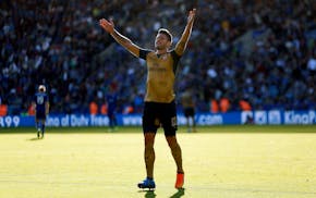 Arsenal's Olivier Giroud celebrates scoring their fifth goal during their English Premier League soccer match at the King Power Stadium on Sept. 26.