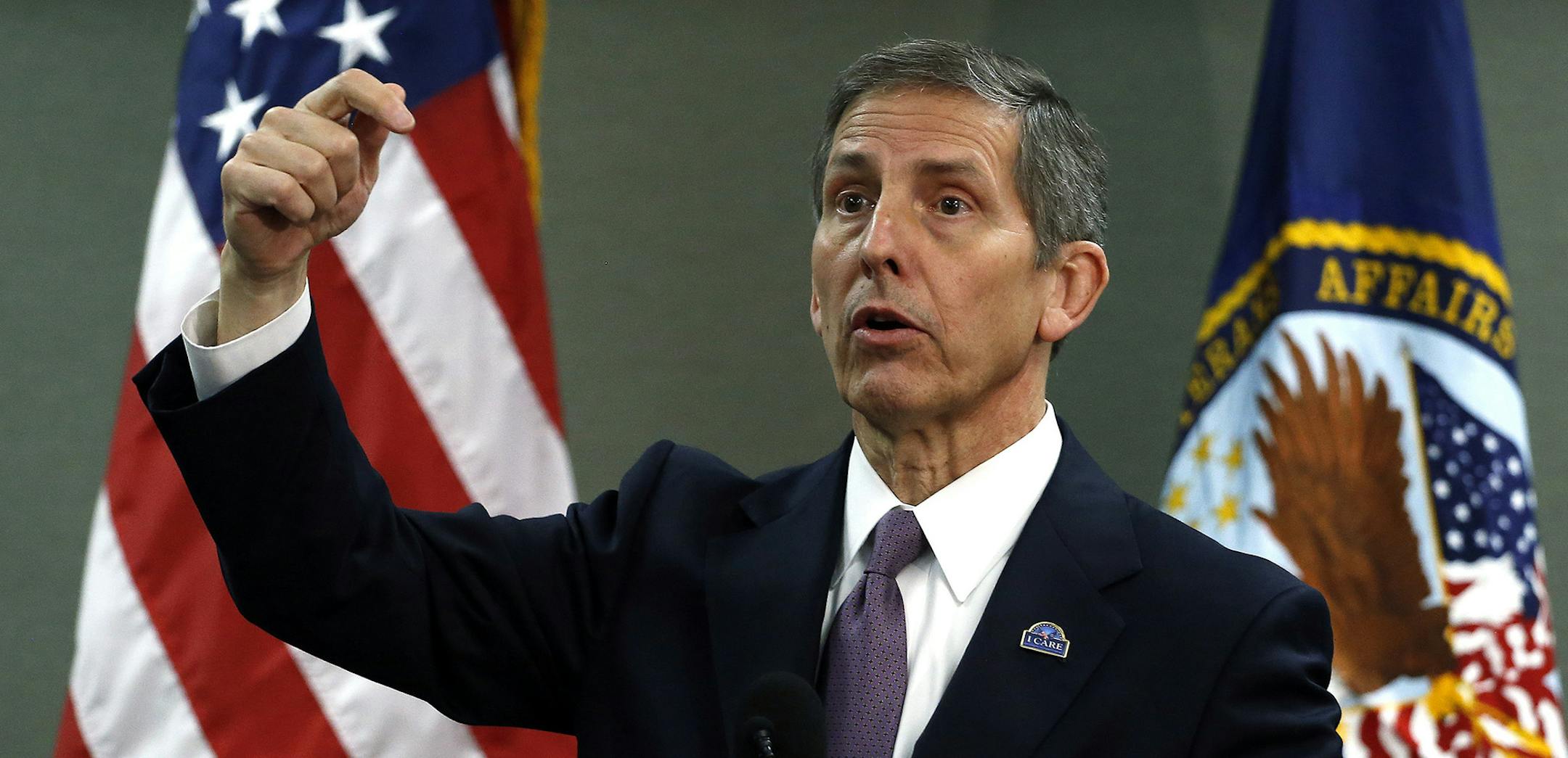 FILE - In this Aug. 6, 2014, file photo, Deputy Veterans Affairs Secretary Sloan Gibson speaks during a news conference during a visit to a Denver veterans hospital. The Veterans Affairs Department is firing four senior executives as officials move to crack down on wrongdoing following a nationwide scandal over long wait times for veterans seeking medical care, and falsified records covering up the delays. Gibson said Monday, Oct. 6, the VA will "actively and aggressively pursue disciplinary act