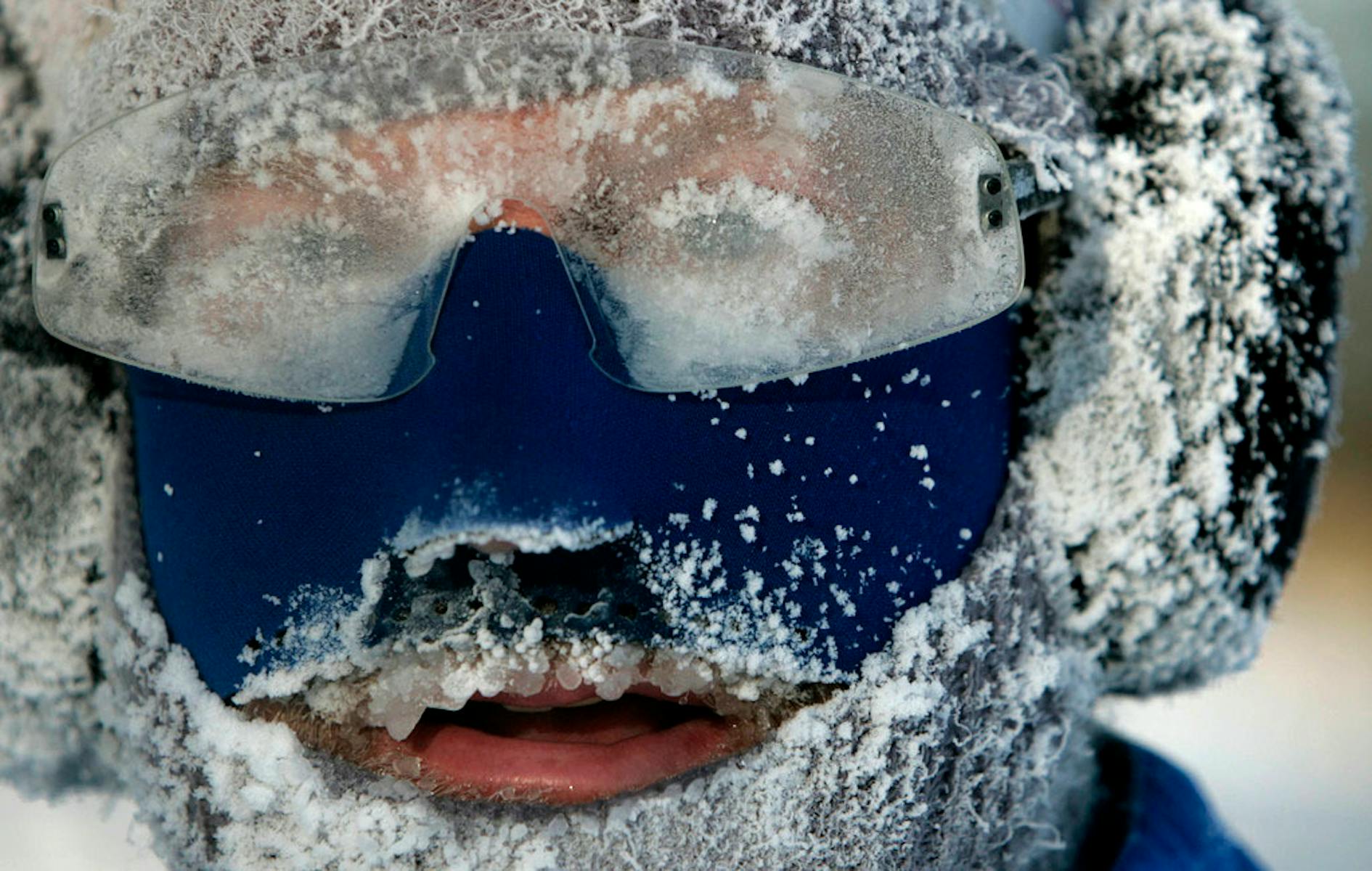 A runner braves the cold in Minneapolis, jogging around Lake Calhoun during an extreme cold snap.