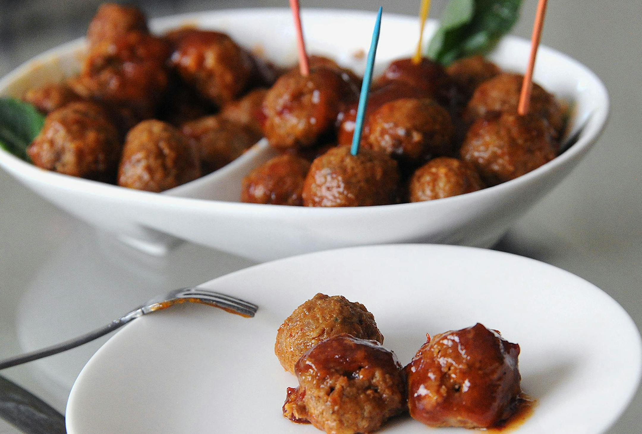 Lamb meatballs glazed in chile pepper jelly.