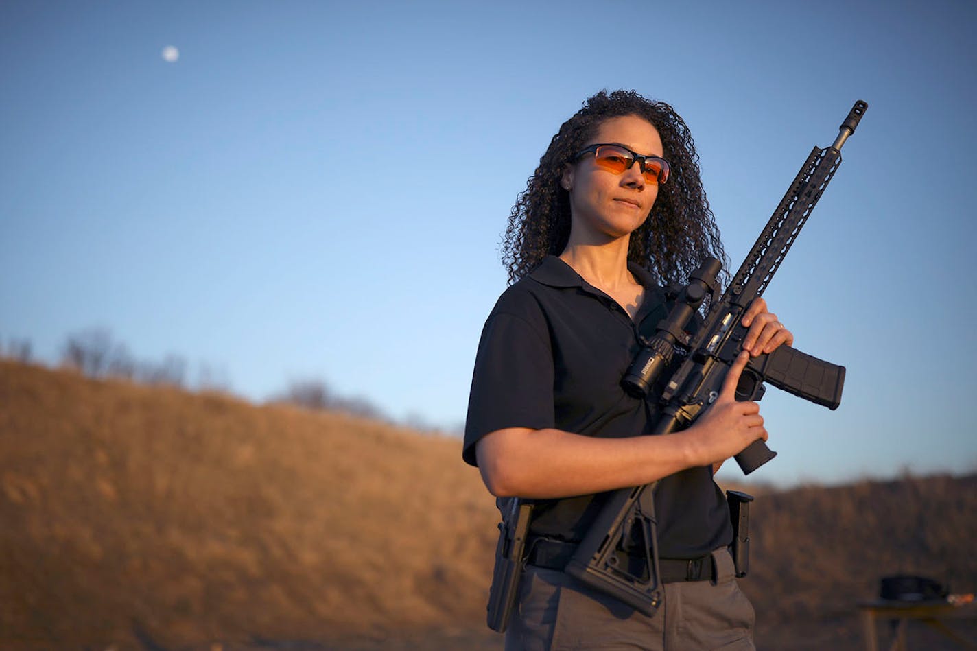 Sarah Cade with the AR-15 platform gun she customized herself according to her preferences, at the gun club she belongs to in Cedar. ] JEFF WHEELER ï jeff.wheeler@startribune.com Sarah Cade is a young, bi-racial, liberal woman. She's also a self-described gun nut and gun rights advocate. Cade, a spokeswoman for the Minnesota Gun Owners Caucus, owns an AR-15, shoots competitively, and has a concealed carry permit. Cade was photographed at the Beaverbrook Tri-County Sportsmen's Club in Cedar Thurs