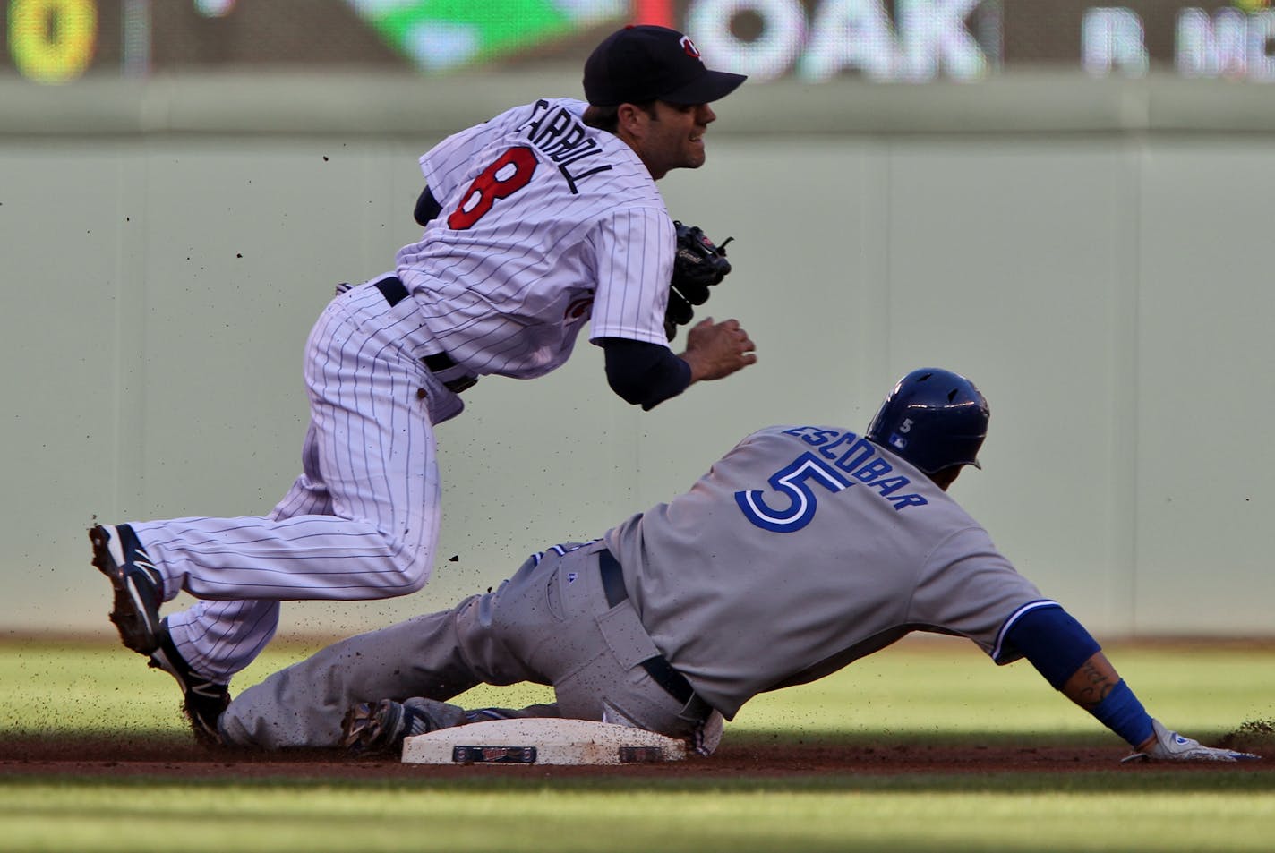 Jamey Carroll (left) started the season at shortstop, but he now brings versatility to the Twins by being able to play second base or third base, too.