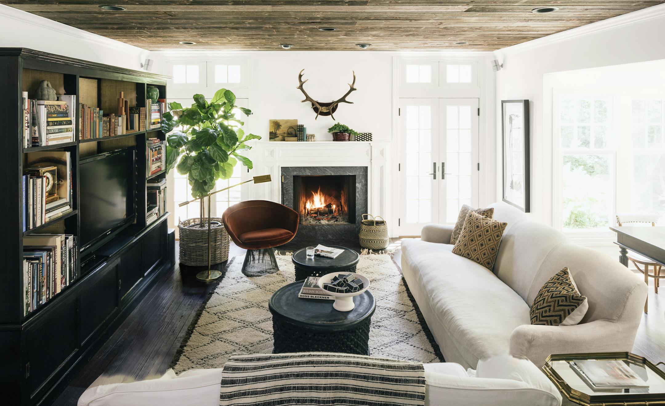 Eclectic can be elegant: The family room of Scheeler's home outside Chicago showcases the same vision — clean lines, prints and points of rich color — that she brings to her job.