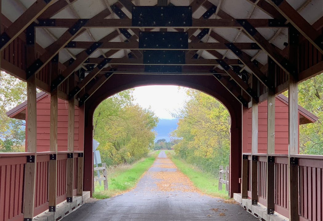 The covered bridge at Holdingford frames the scenic countryside that awaits riders.