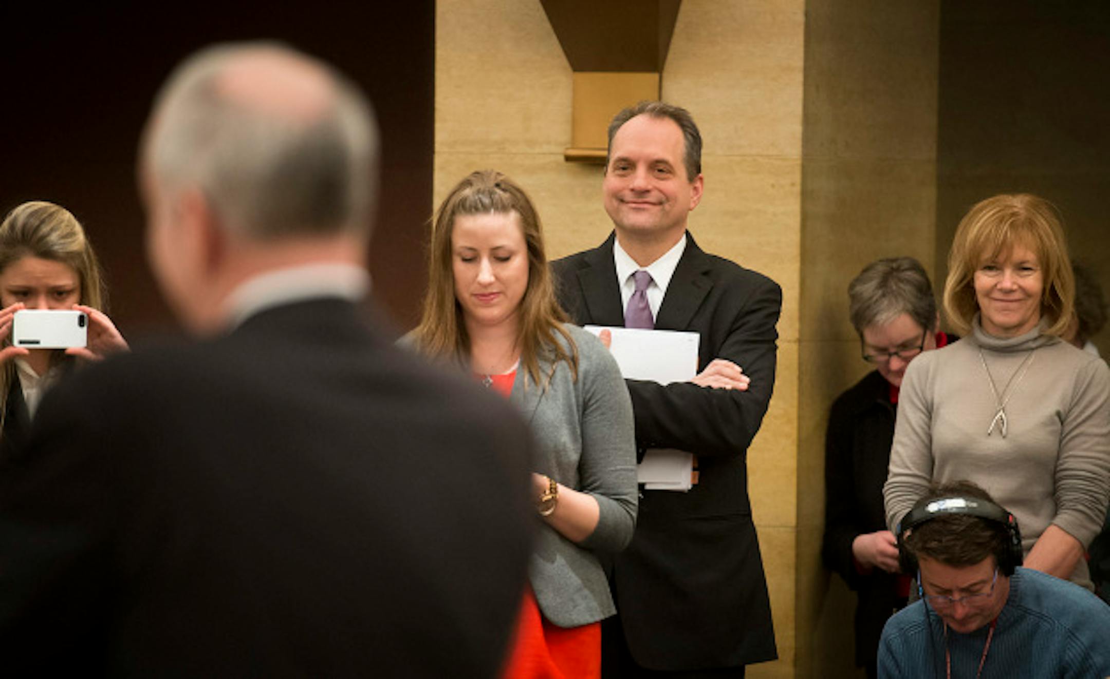 Minnesota Management & Budget Commissioner Jim Schowalter and members of the Governor's staff listened as Governor Mark Dayton spoke to reporters about the State of Minnesota February Budget Forecast on Thursday, February 28, 2013.    ]   GLEN STUBBE * gstubbe@startribune.com