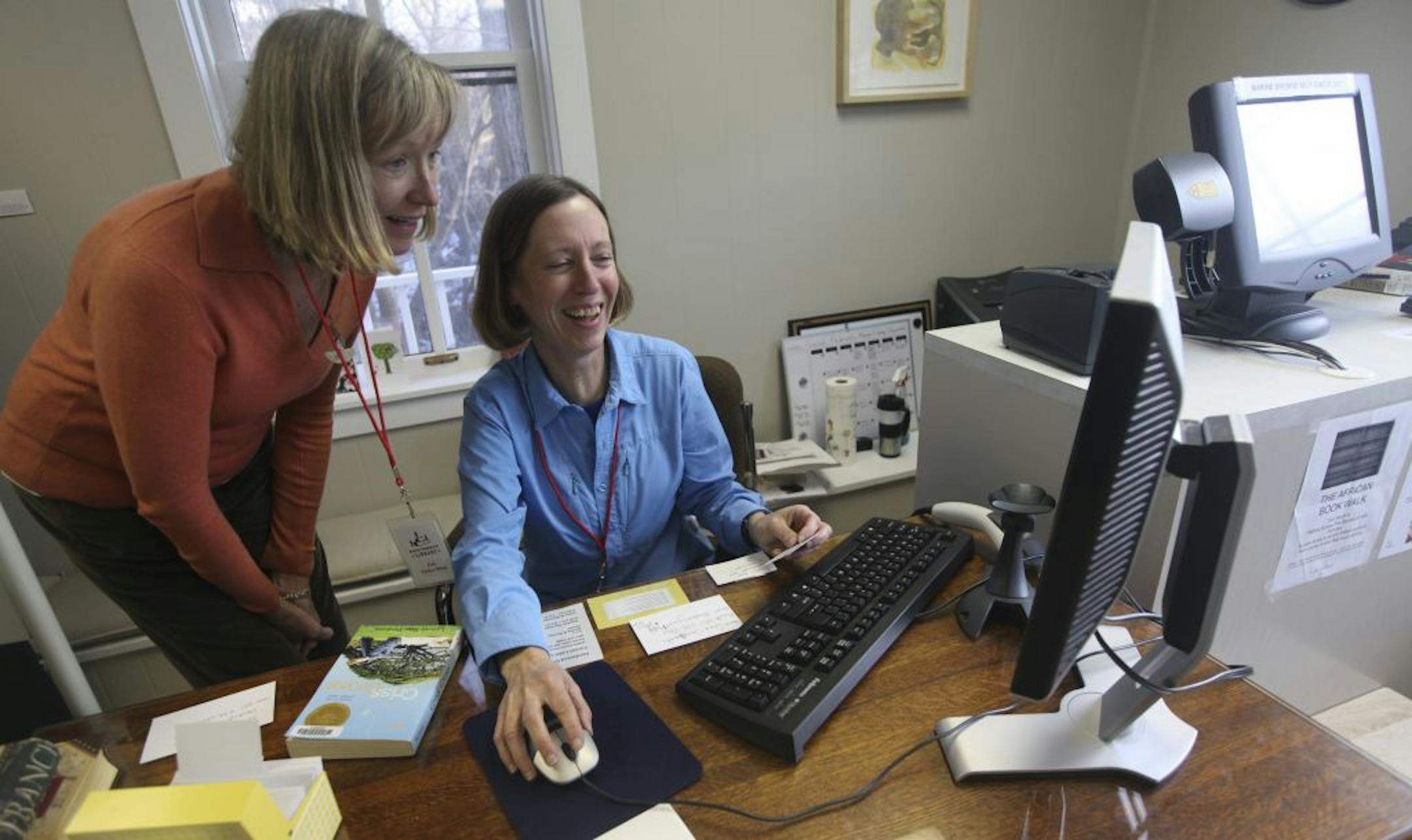 Sue Logan showed volunteer Deb Yanker Black how to register people for the library in Marine on St. Croix Min., Tuesday, February 7, 2012.