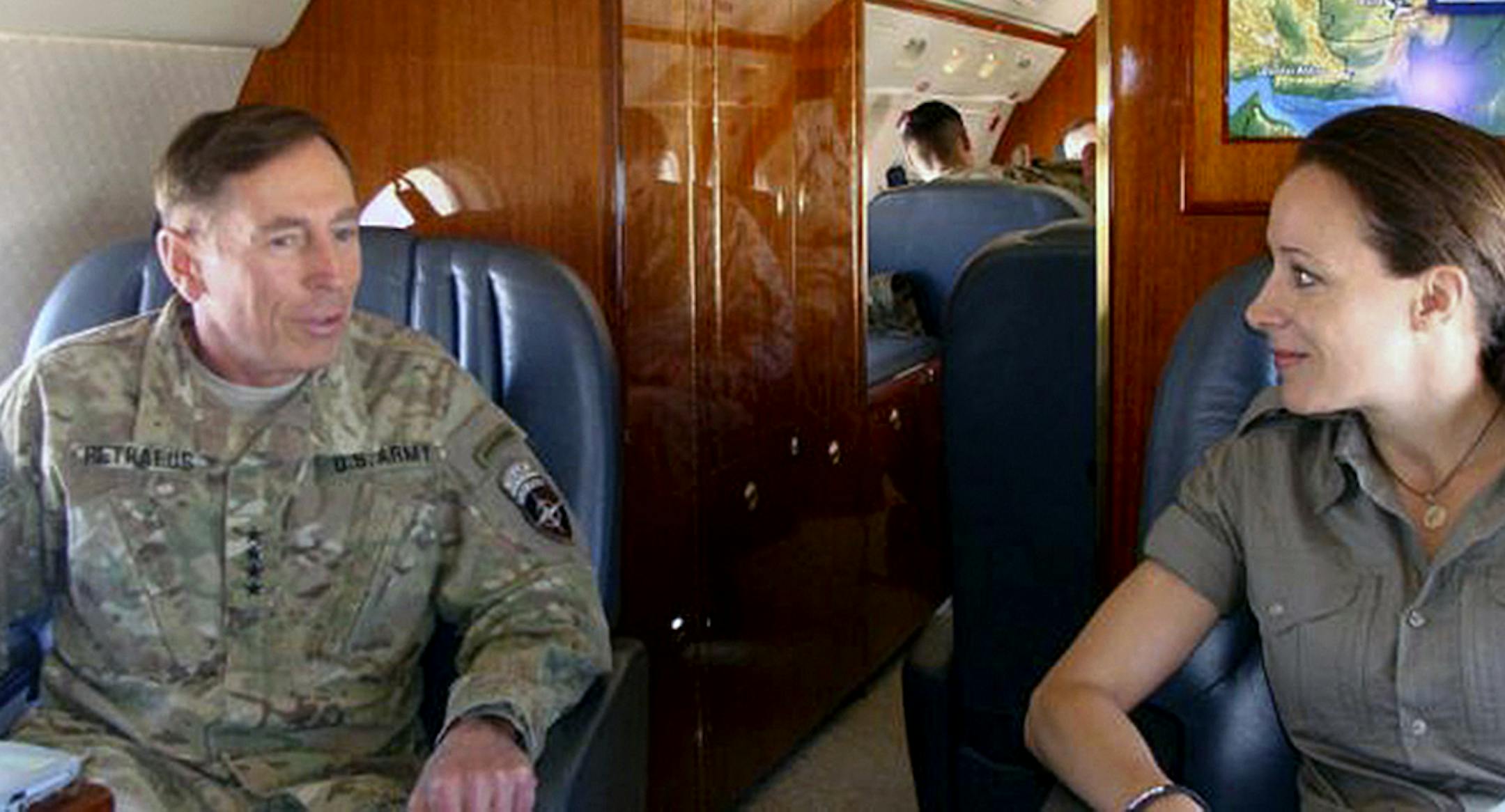 David Petraeus, former Central Intelligence Agency Director, with Paula Broadwell, the author of his biography, flying to Helman Province, Afghanistan in June 2011.