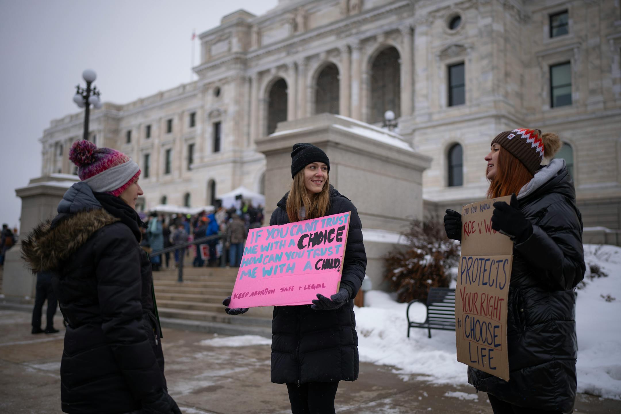 Two pro-choice advocates engaged people attending the Minnesota Citizens Concerned for Life 50th March for Life, the first since Roe was overturned at the State Capitol.