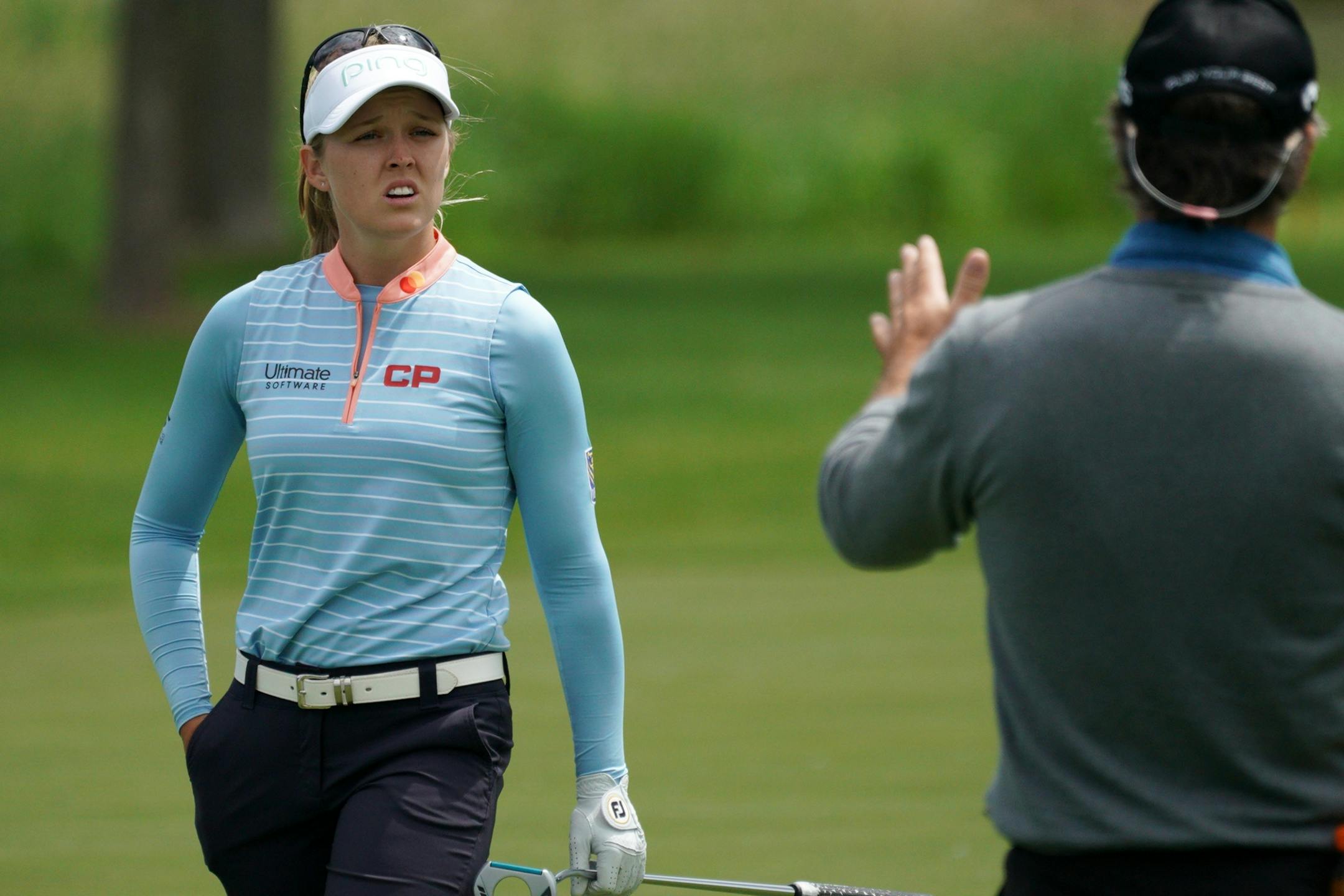 Brooke Henderson talked with her father Dave Henderson on the 16th fairway Tuesday afternoon.