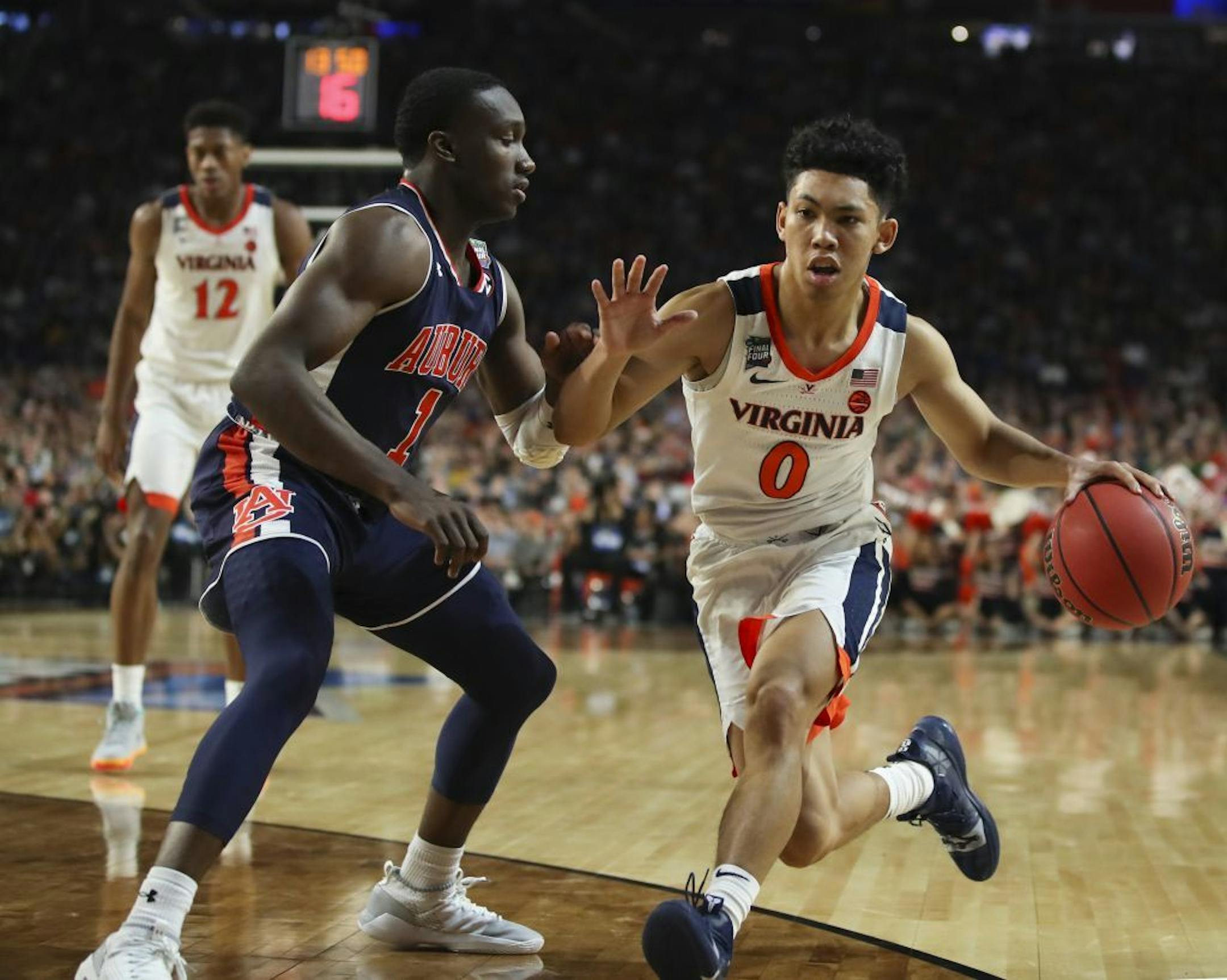 Auburn forward Horace Spencer (0) drove into Auburn guard Jared Harper (1) during the second half.