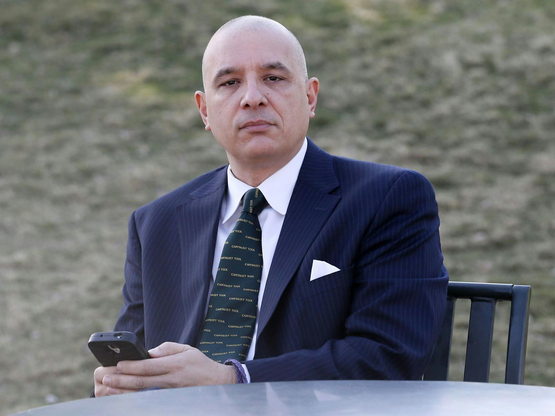 Bert Martinez poses for a photo, Tuesday, March 24, 2015, in Gilbert, Ariz. Martinez, the owner of a public relations firm in Phoenix, consulted his lawyer when one of his employees posted critical comments about him and his company on Facebook last year, but was unable to fire the employee for the criticism. (AP Photo/Matt York) ORG XMIT: NYBZ178