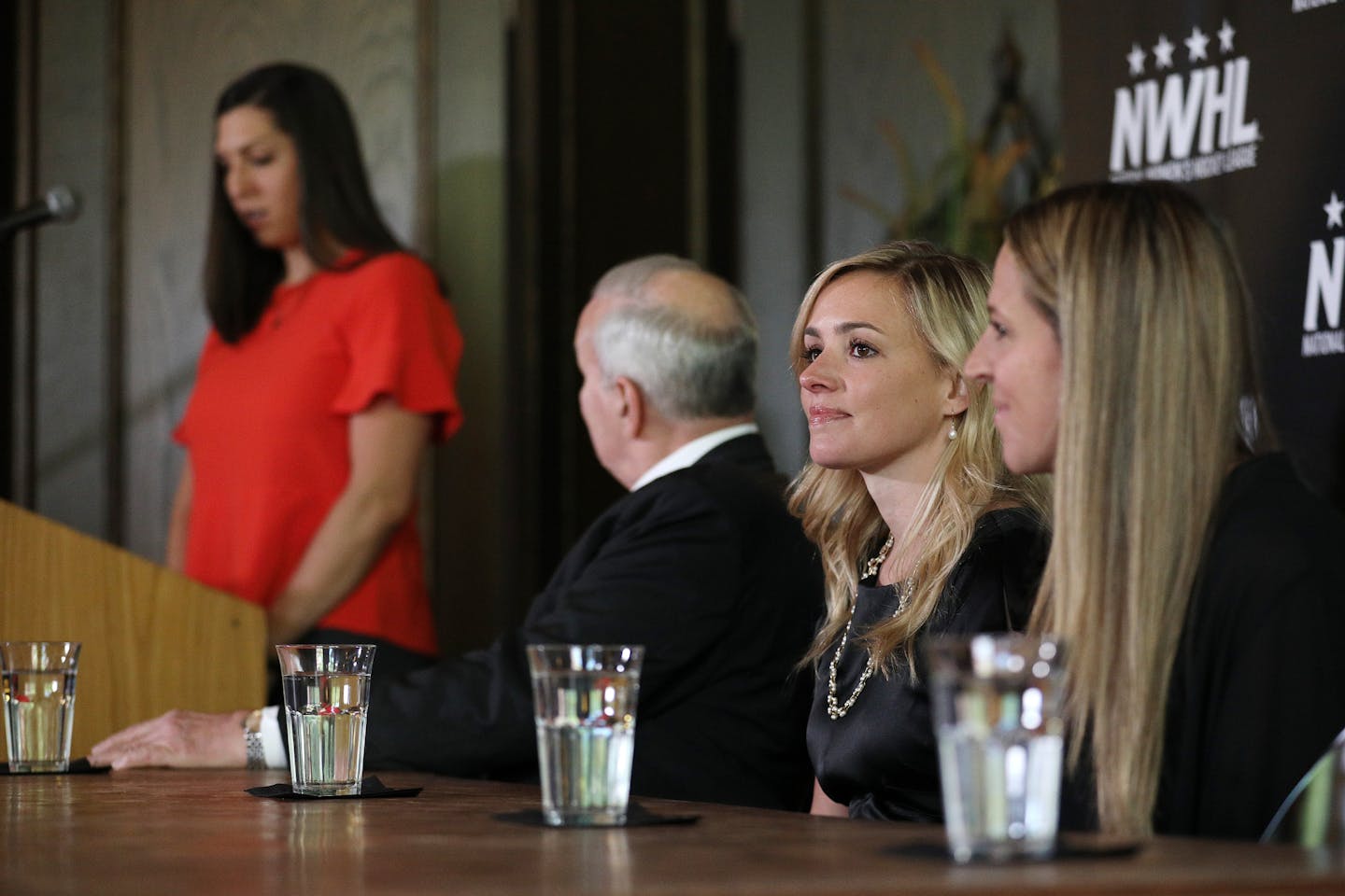 National Women's Hockey League founder and commissioner Dani Rylan, center, looked out to the media as deputy commissioner Hayley Moore spoke during Tuesday's announcement. ] ANTHONY SOUFFLE &#xef; anthony.souffle@startribune.com Officials with the National Women's Hockey League held a press conference to announce they had acquired the Minnesota Whitecaps Tuesday, May 15, 2018 at Herbie's on the Park in St. Paul, Minn.