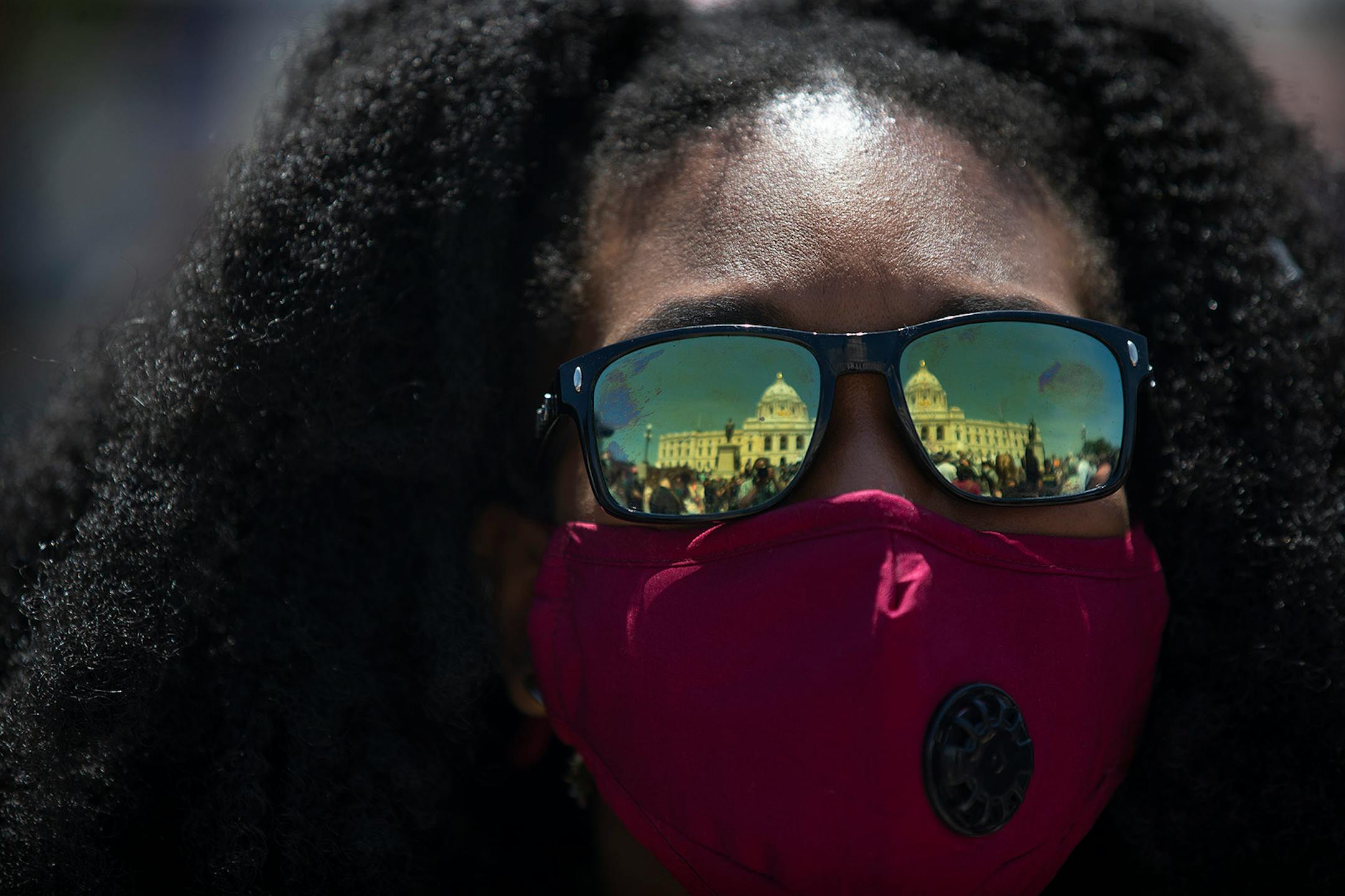 The Minnesota Capitol was reflected in the sunglasses of a protester who attend a rally for justice for George Floyd in St. Paul on Sunday, May 31, 2020,