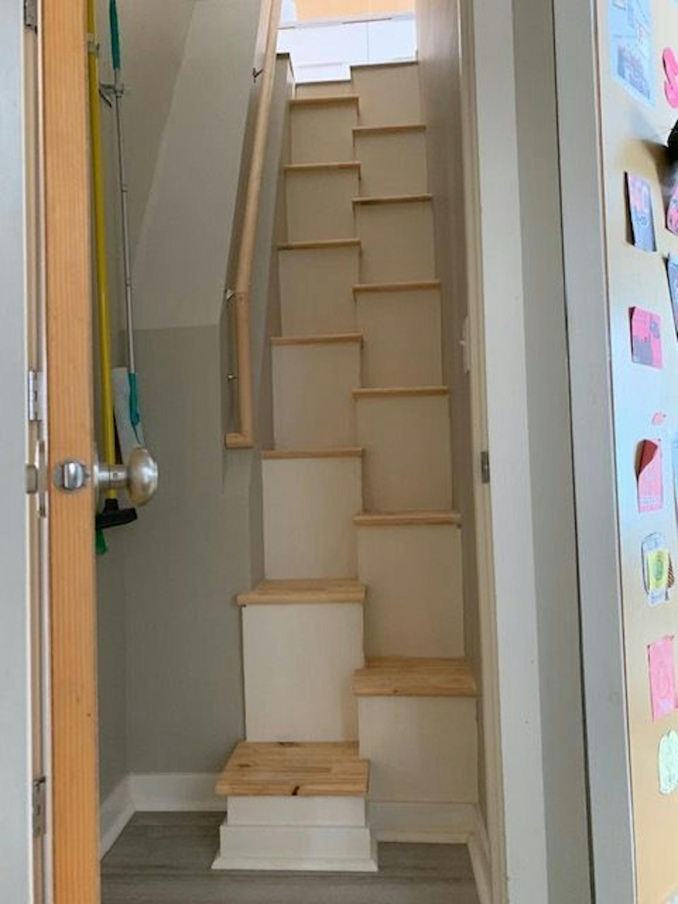 Inside, a staircase with alternating treads saves on space.