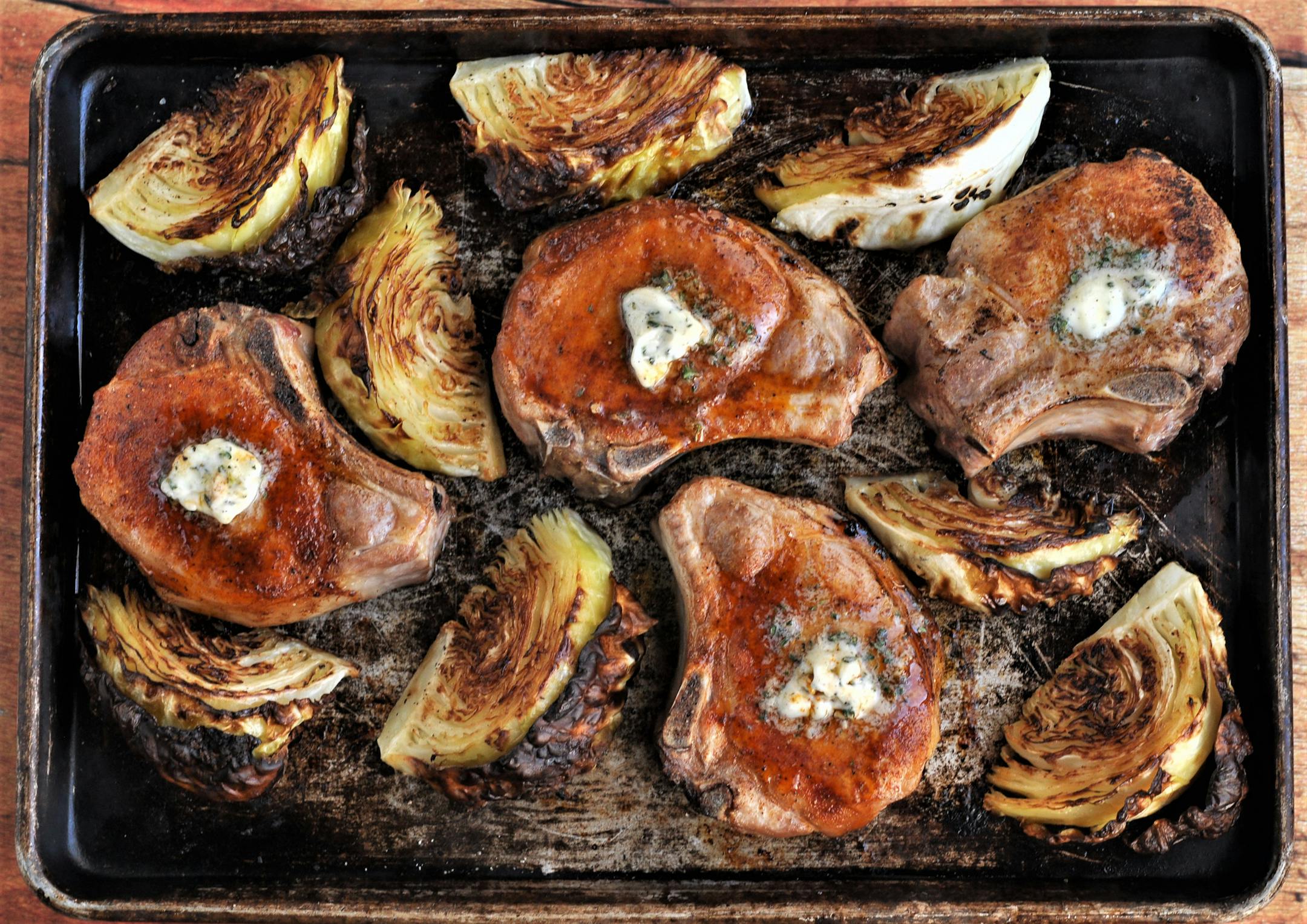 Roasted Pork Chops and Cabbage with Garlic Thyme Butter is a quick meal for a weeknight but suitable for weekend entertaining, too. Recipe and photo by Meredith Deeds, Special to the Star Tribune