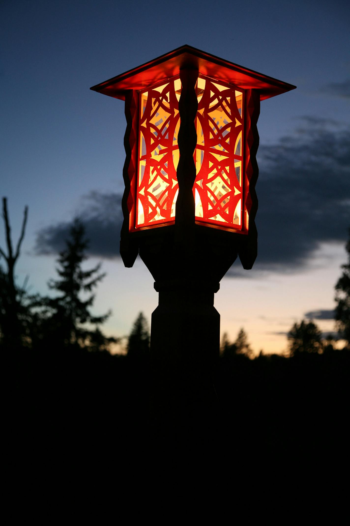 The design motif of the historic club carries through to every detail, including outdoor lighting.