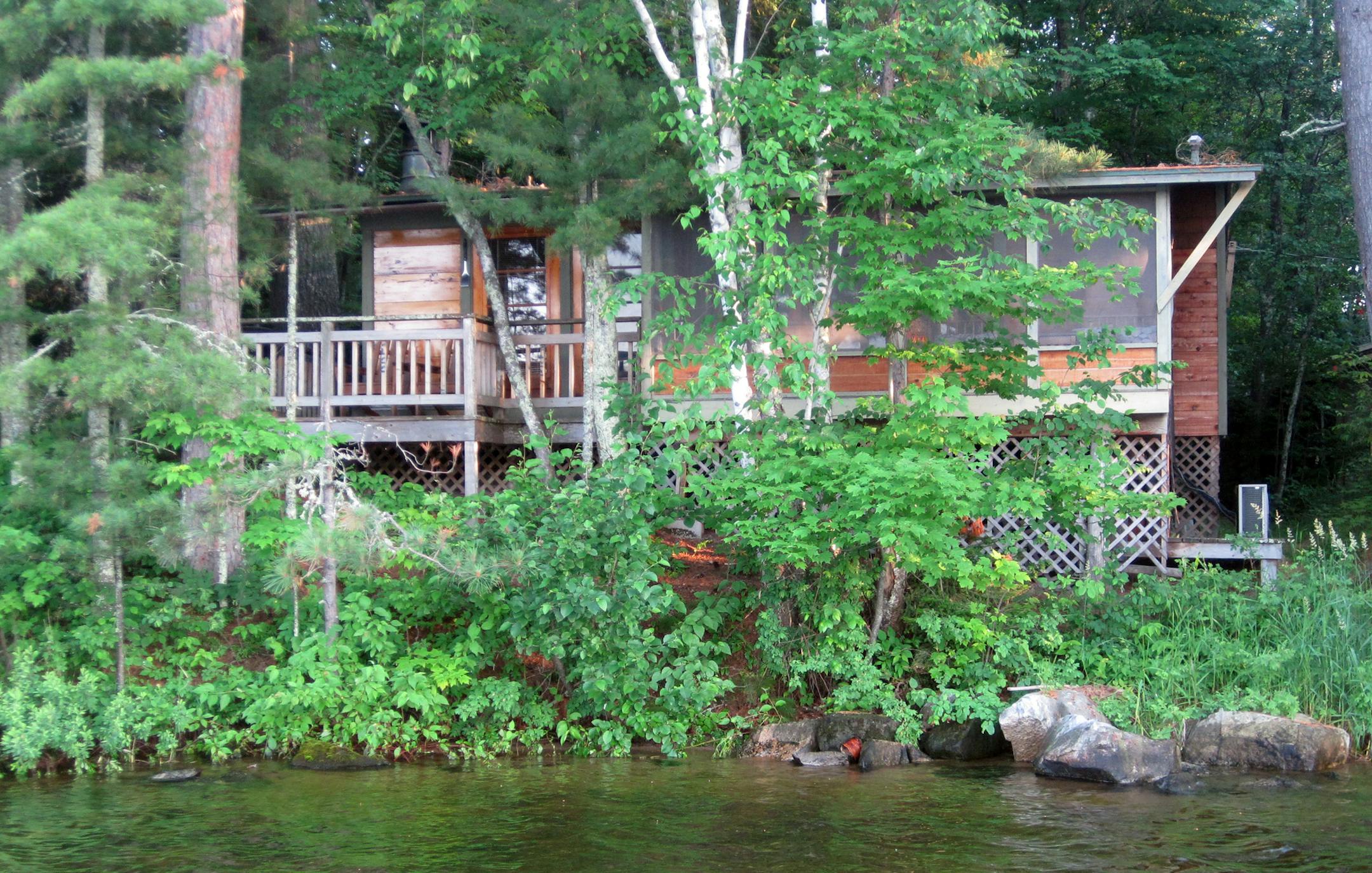 All of the cabins at Ludlow's Island Resort have screened porches and decks. This one, Dusk, is a two-bedroom built in 1955. ] Photo by KERRI WESTENBERG