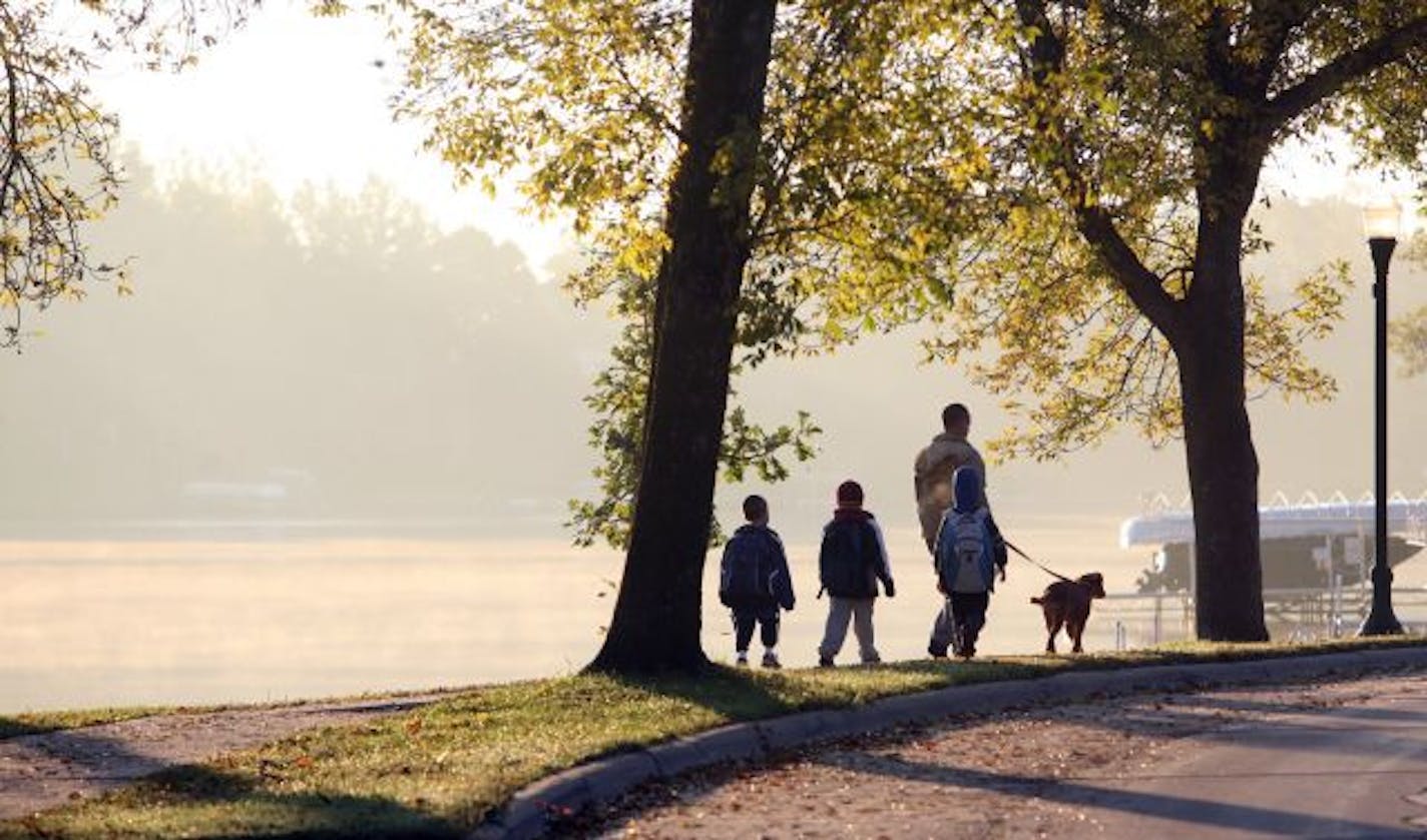 Walkers headed to Lakeview Elementary School last week. About 30 children gather at 7:40 a.m. three days a week for the half-mile "walking school bus" hike to the school. Some plan to continue the walk even as the Blue Zones project comes to an end.