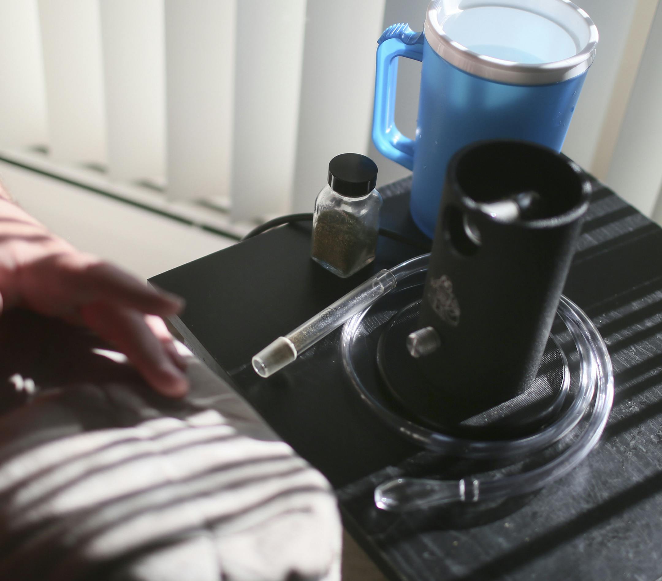 Patrick McClellan prepared to treat severe pain from muscular dystrophy by vaporizing plant marijuana. McClellan says he uses the illegal drug because it always works and does so within 90 seconds.