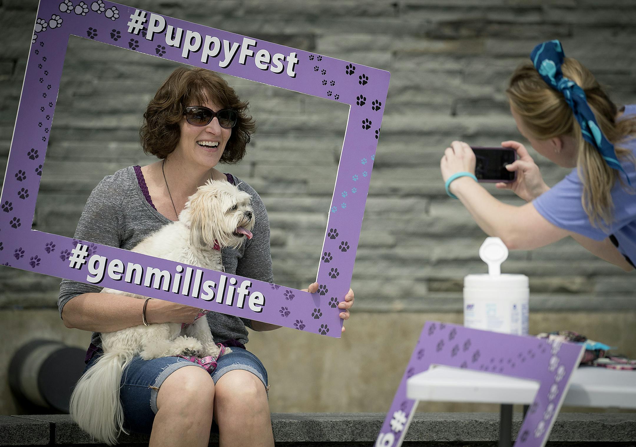General Mills employee Ruth Hovey was all smiles with her rescue dog "Molly," as she got her picture taken at the 3rd Annual Puppy Fest at General Mills, Friday, June 22, 2018 in Golden Valley, MN. ] ELIZABETH FLORES ï liz.flores@startribune.com