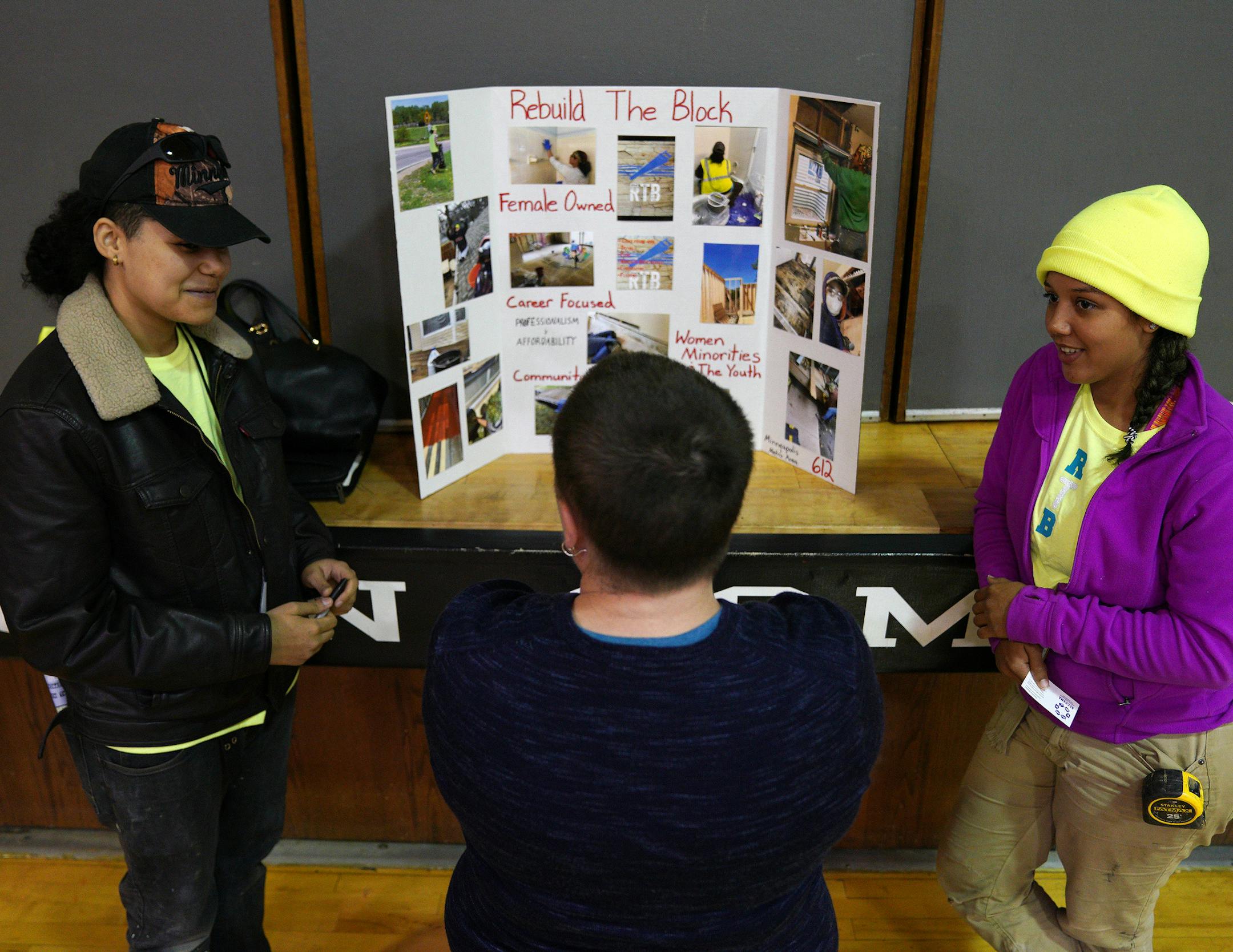 Victoria Moorhead, left, and Alex Dixon, right, who won second place talked about their business Rebuild The Block, a construction company that focuses on community rebuilding and employing women, minorities, and young people. ] ANTHONY SOUFFLE • anthony.souffle@startribune.com Entrepreneurs took part in the second annual Shark Tank competition Saturday, May 18, 2019 at Powderhorn Park Recreation Center in Minneapolis. A take on the popular television show, the event pits small businesses